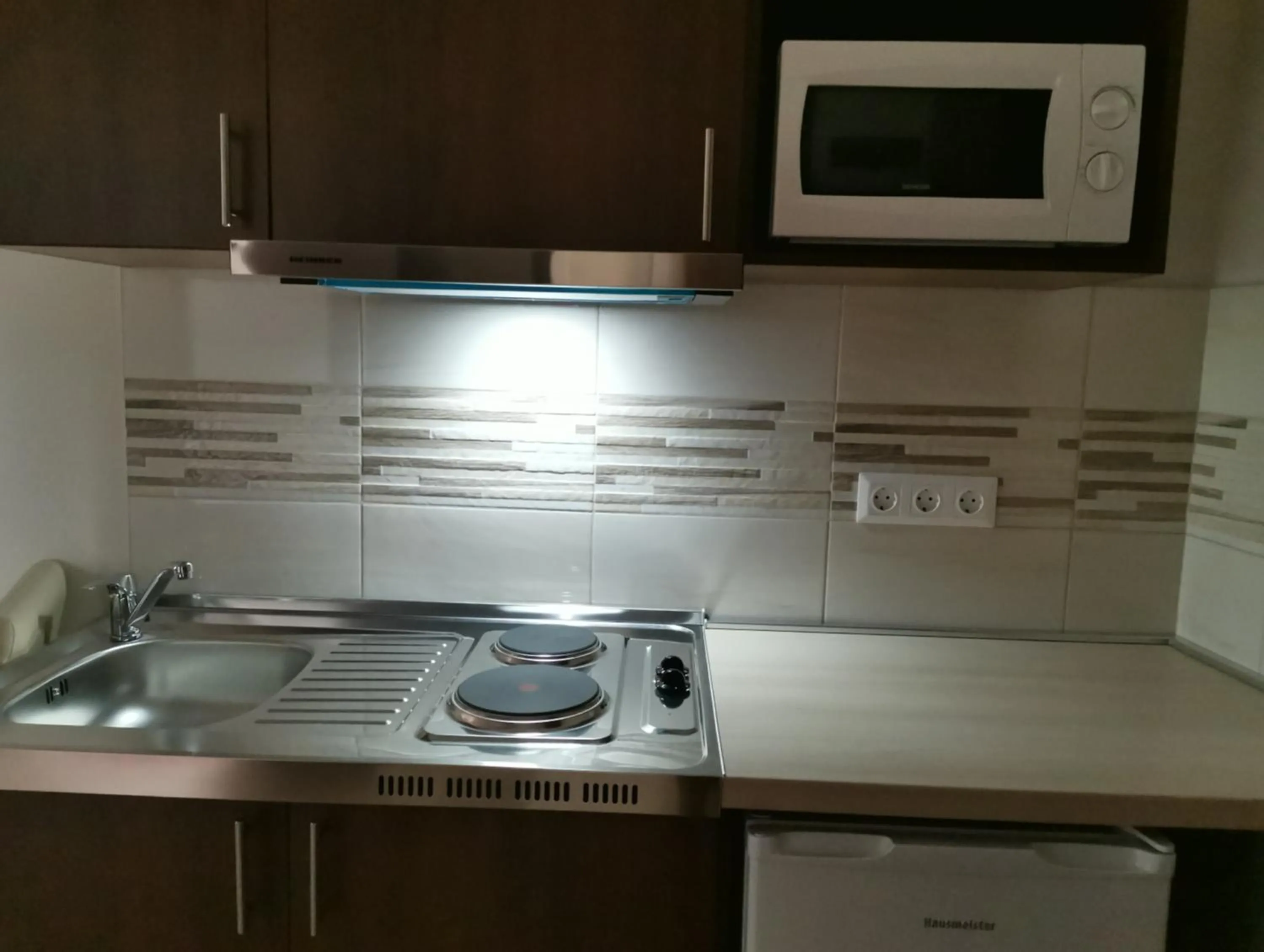 Kitchen or kitchenette in Termál Apartmanház