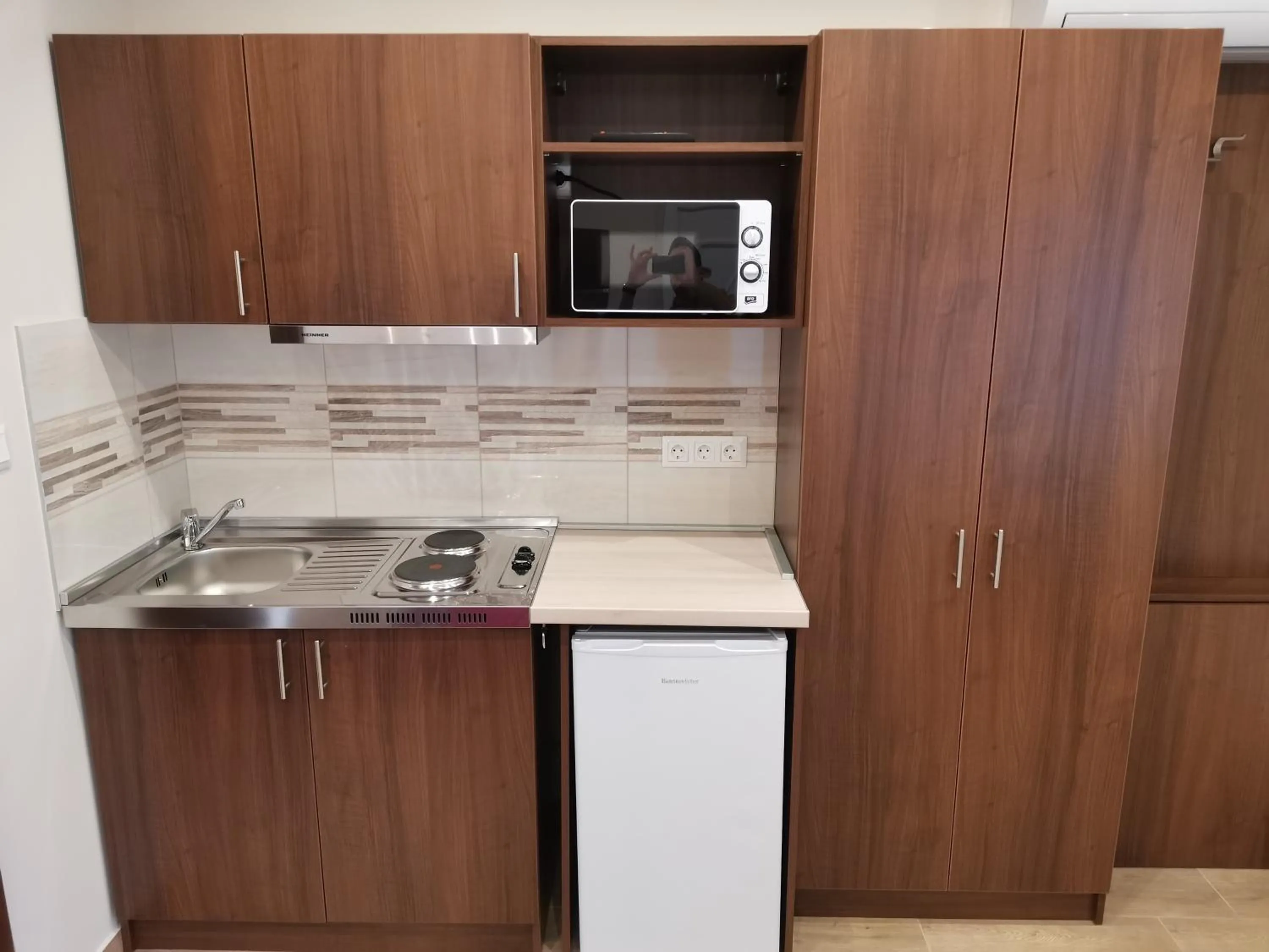 Kitchen or kitchenette in Termál Apartmanház