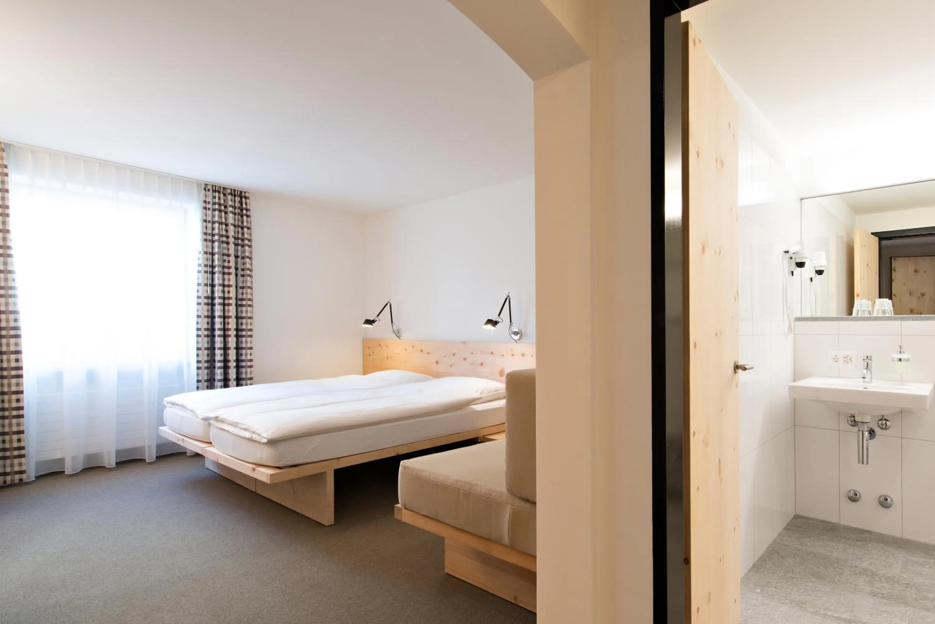 Bed in Hauser Hotel St. Moritz