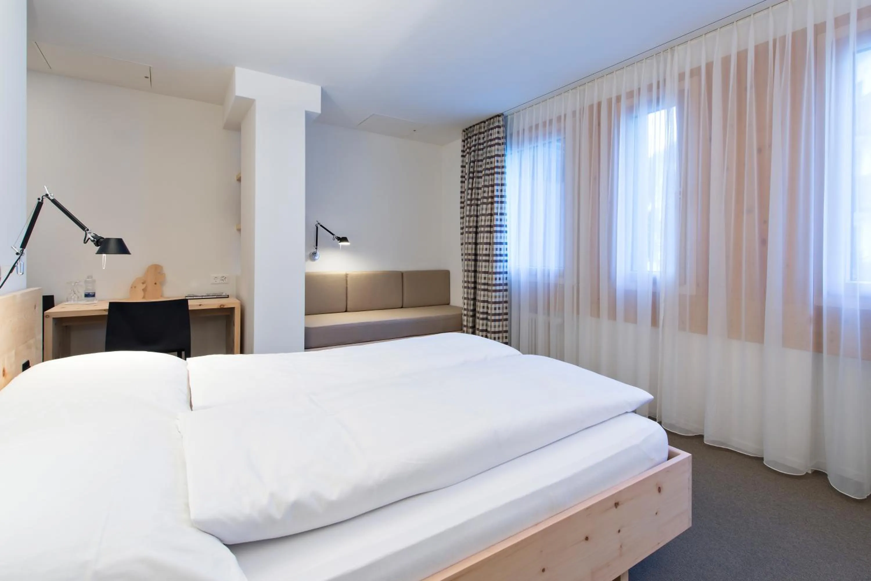 Bed in Hauser Hotel St. Moritz