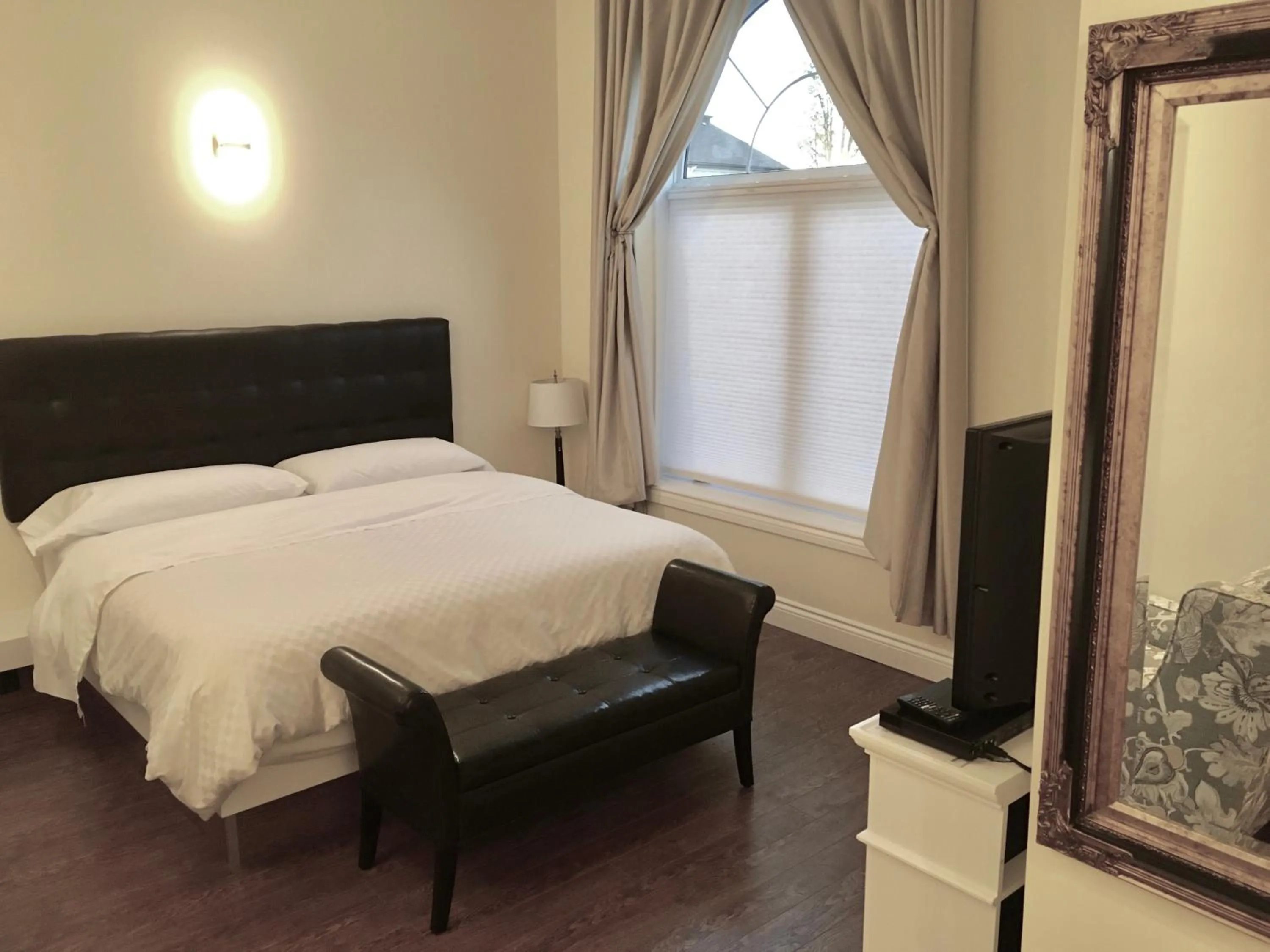 Bed in Grey Rose Suites