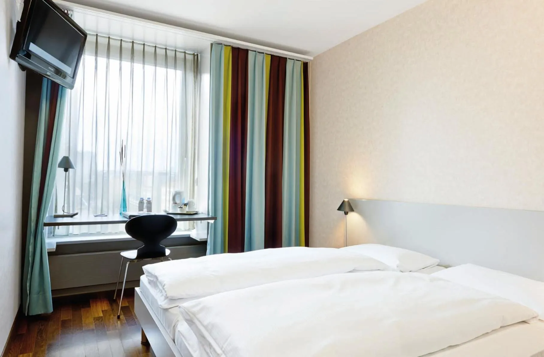 Photo of the whole room, Bed in Sorell Business Hotel Ador Bern