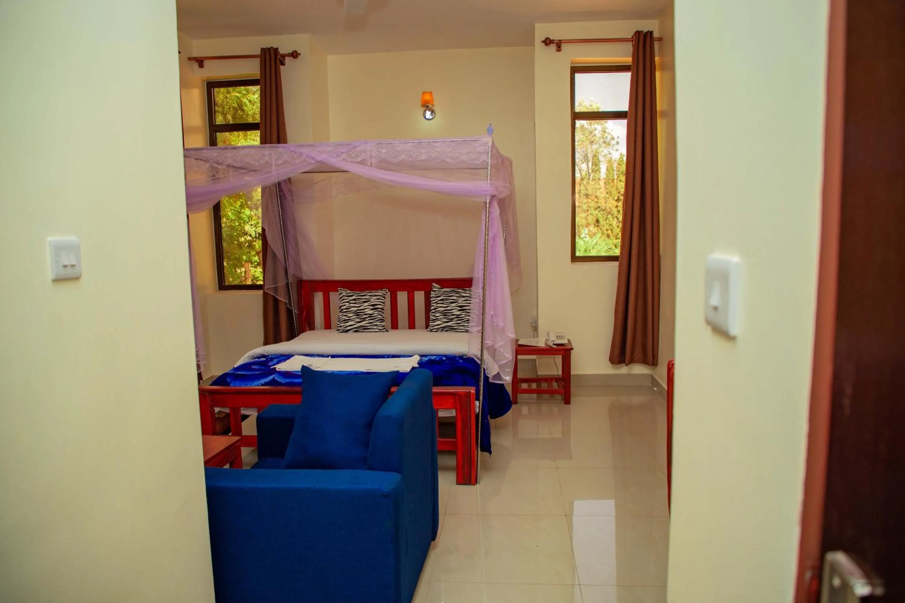 Bed in Kilimanjaro White House Hotel