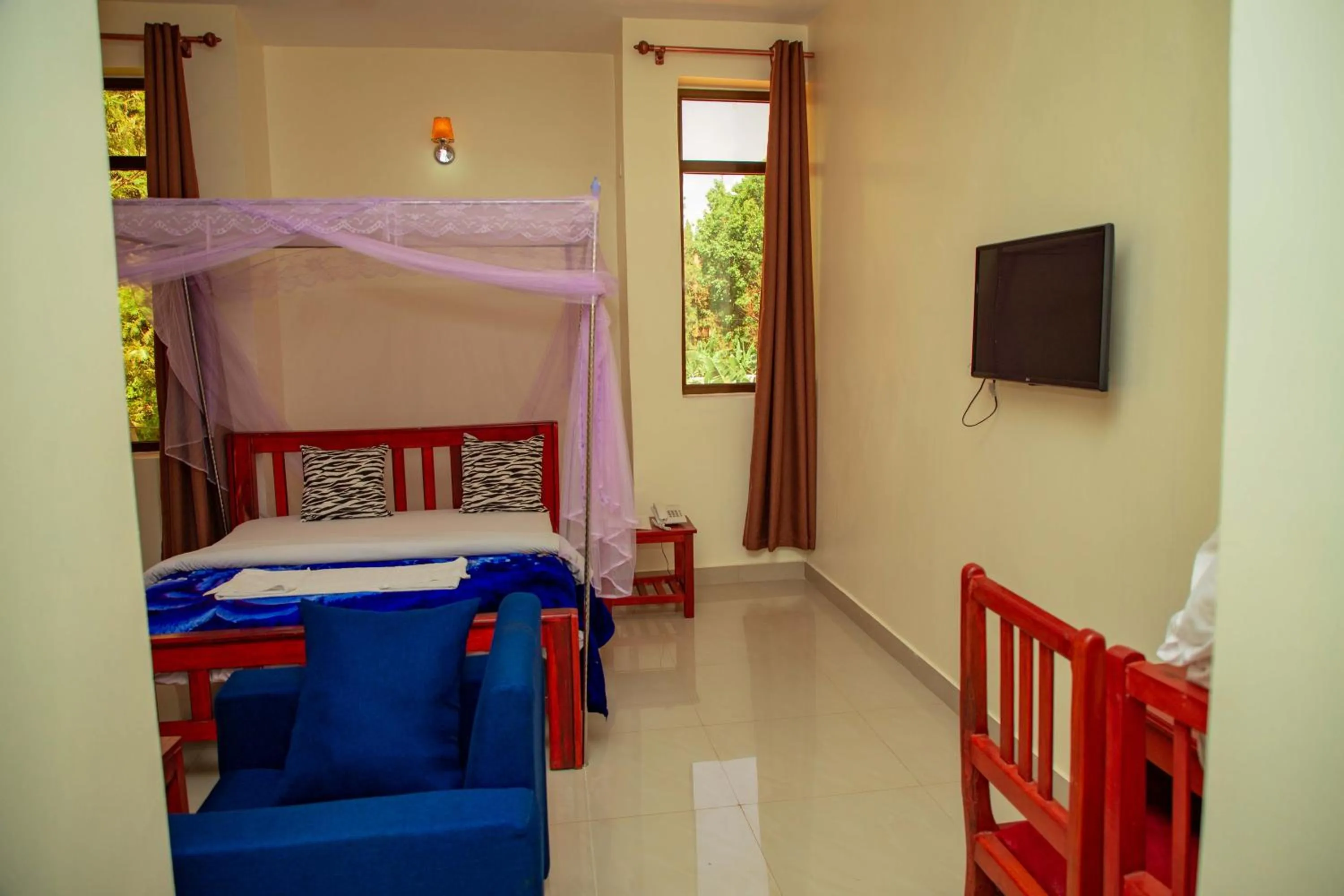 Bed in Kilimanjaro White House Hotel