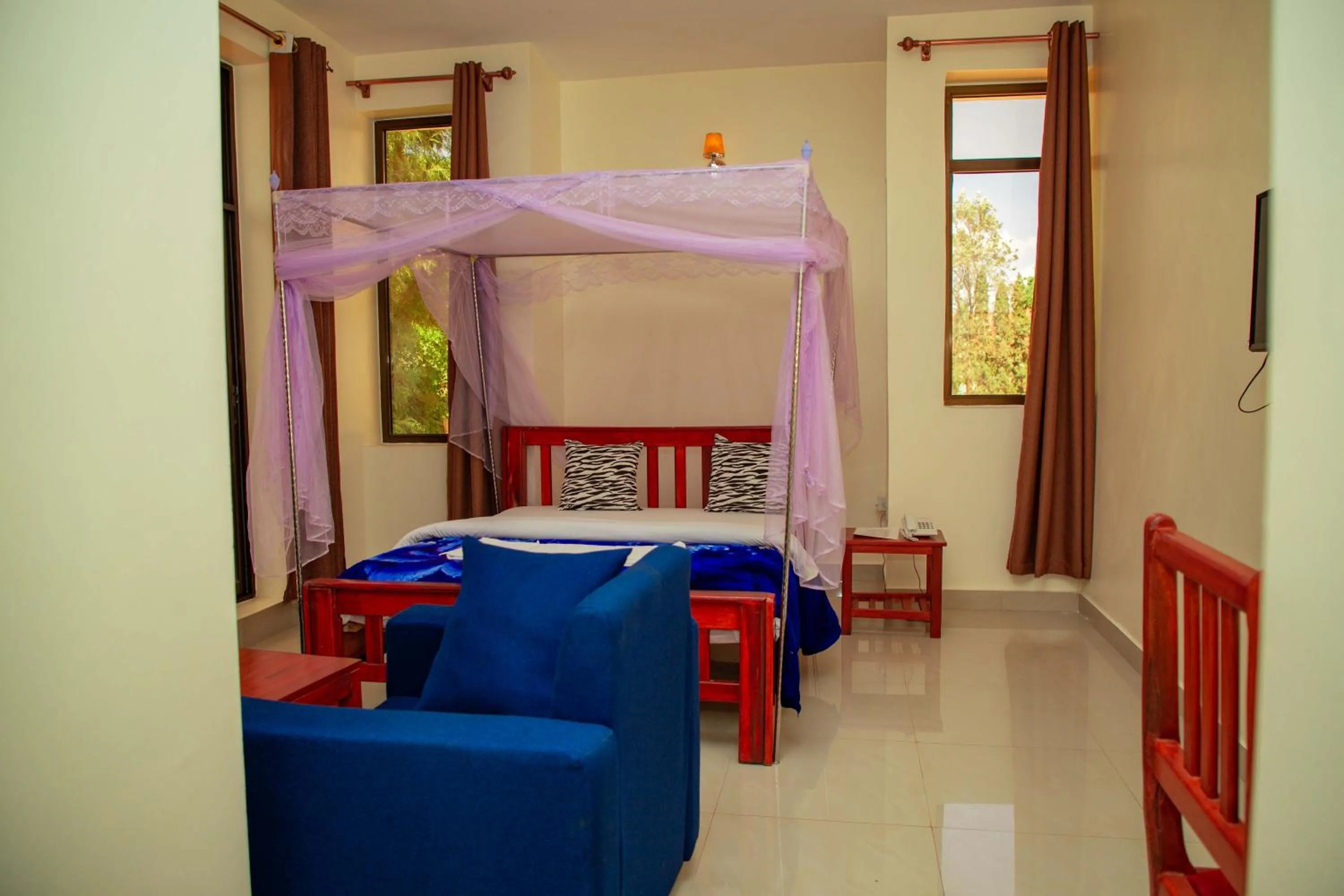 Bed in Kilimanjaro White House Hotel