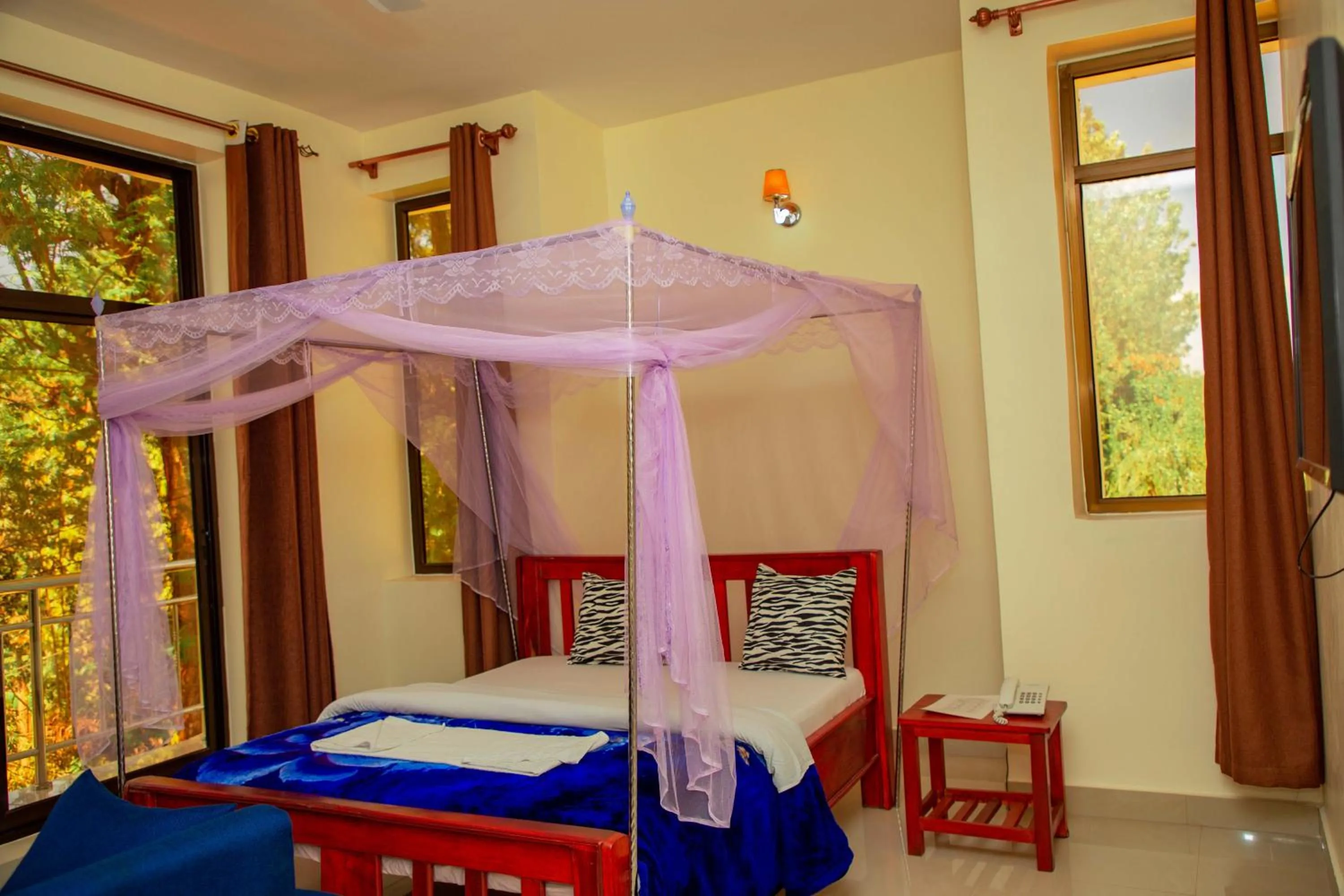 Bed in Kilimanjaro White House Hotel