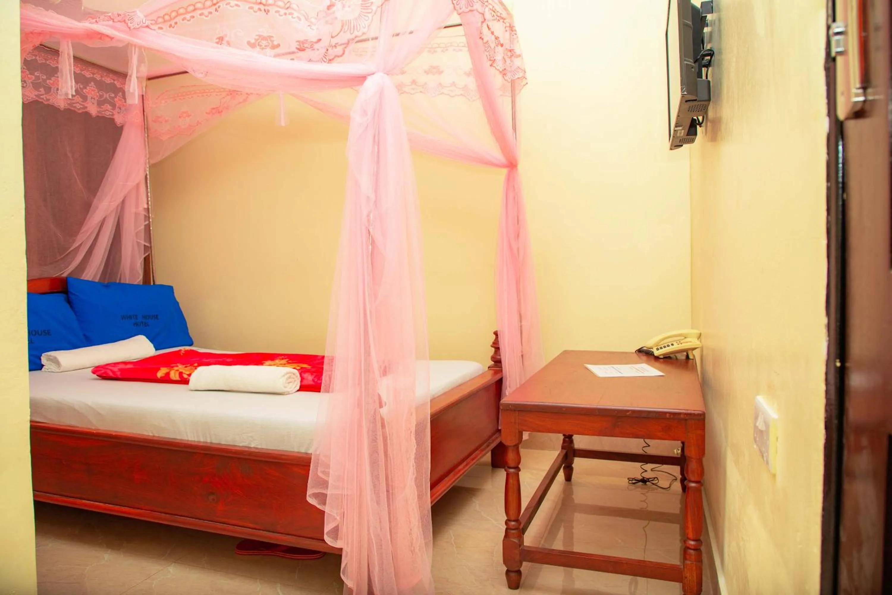 Bed in Kilimanjaro White House Hotel