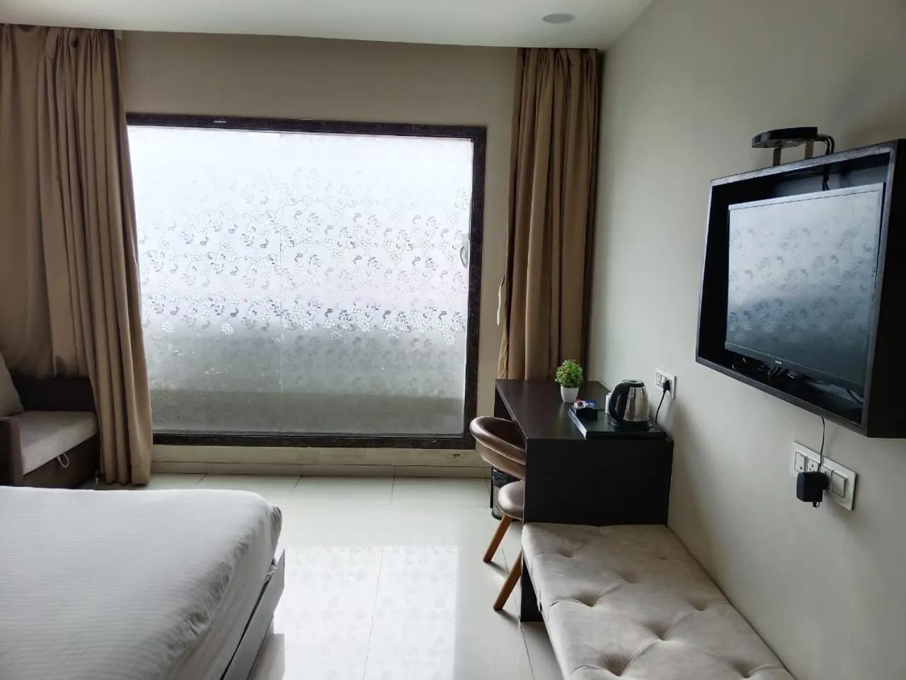 Seating area, Bed in The Aanandam Hotel Resort