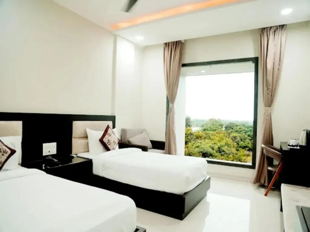 Garden view, Bed in The Aanandam Hotel Resort