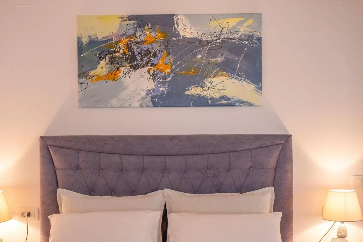 Bed in Serenity Luxe Suites