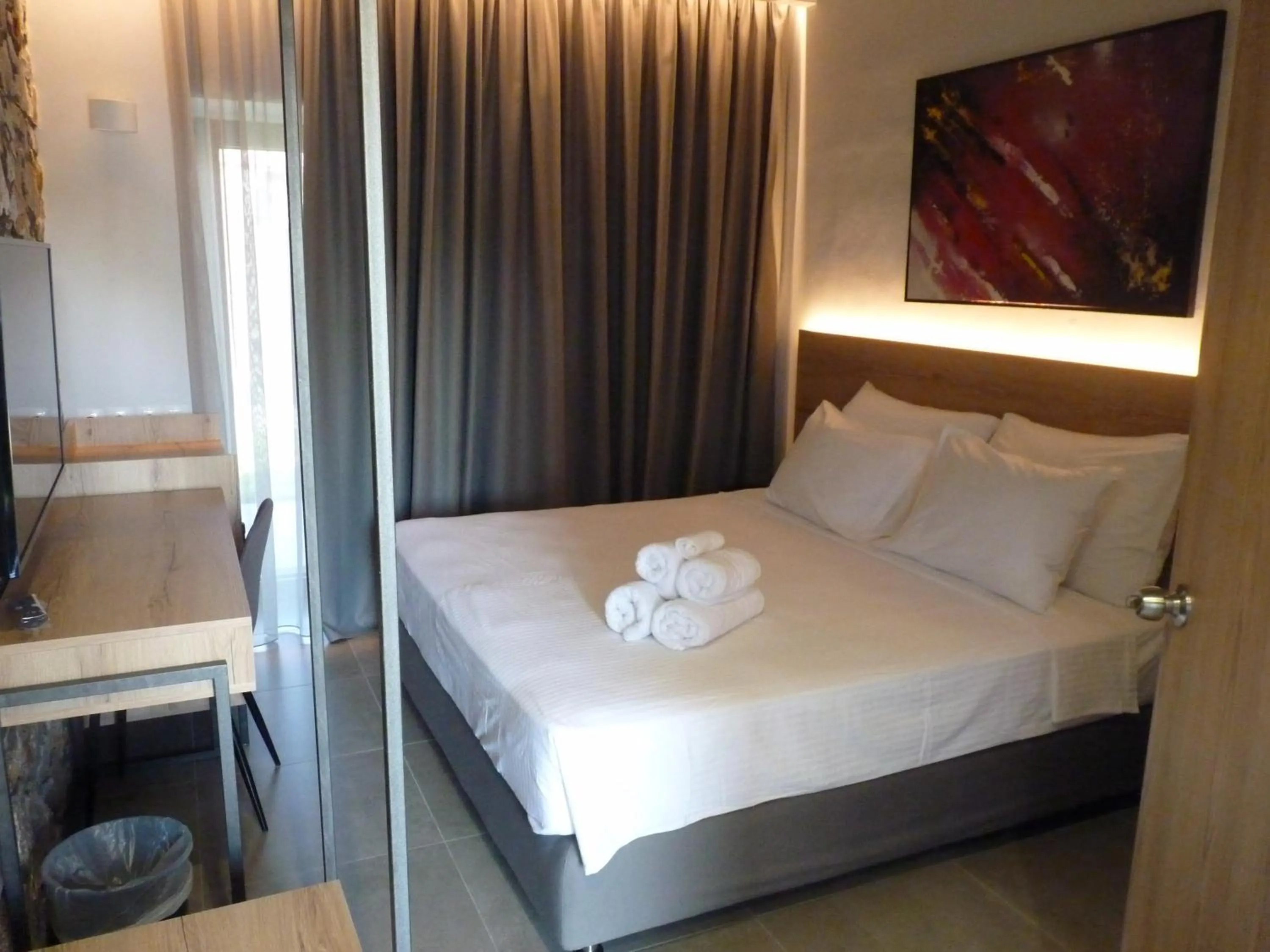 Bed in Comfort Suites & Rooms