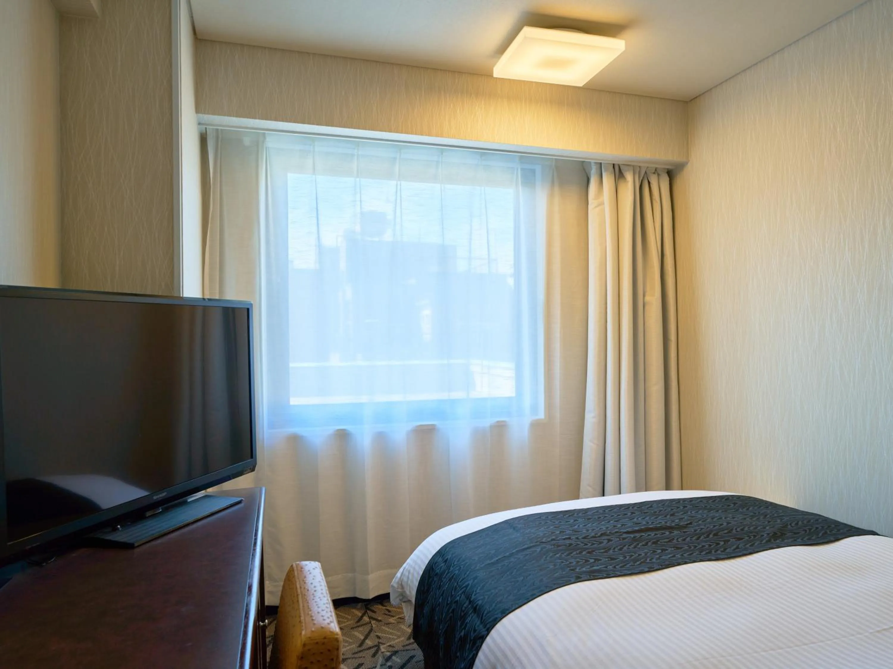 Bed in APA Hotel Matsuyamajo Nishi