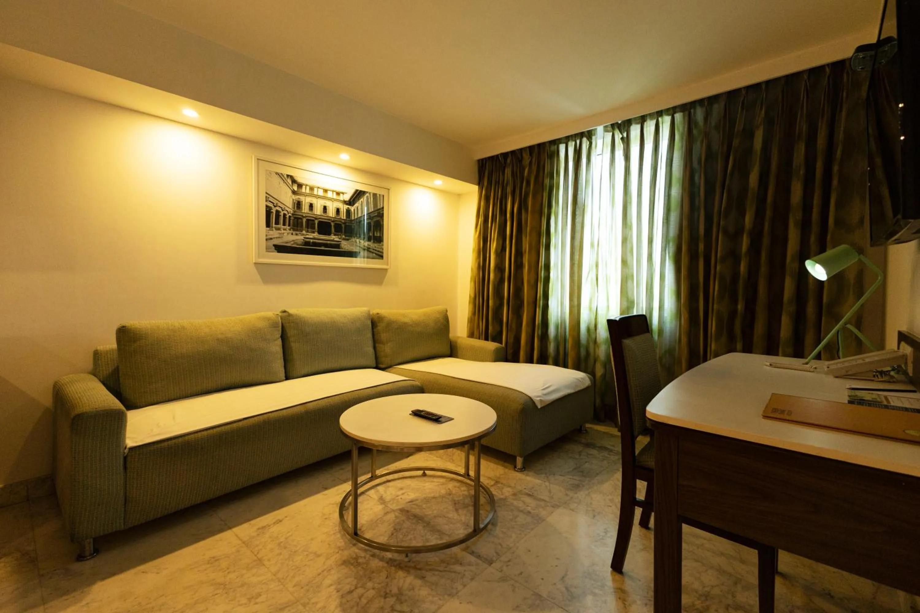 Seating area, Bed in Fairfield by Marriott Pune Kharadi