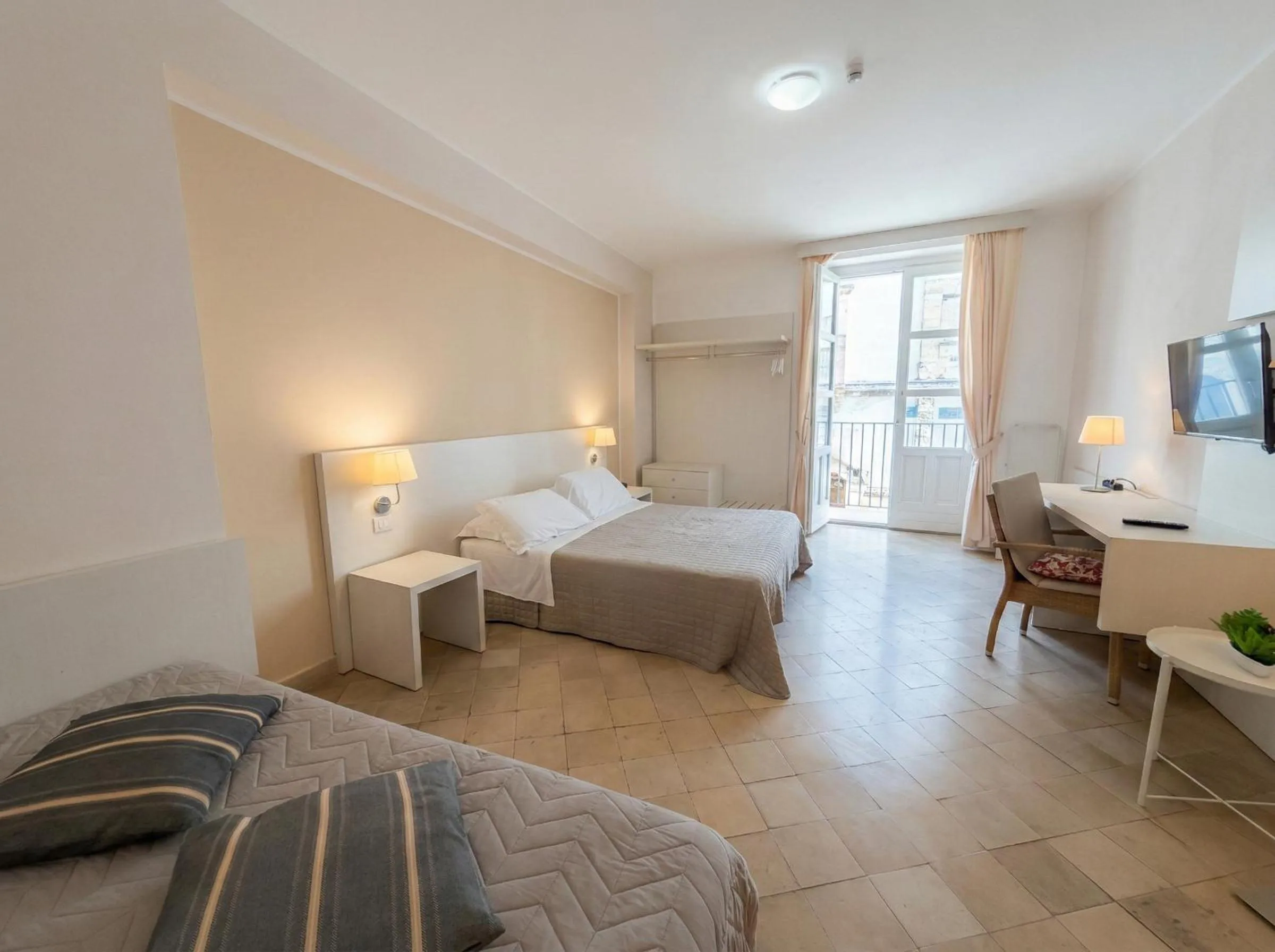 Bed in Ortigia Mastrarua rooms