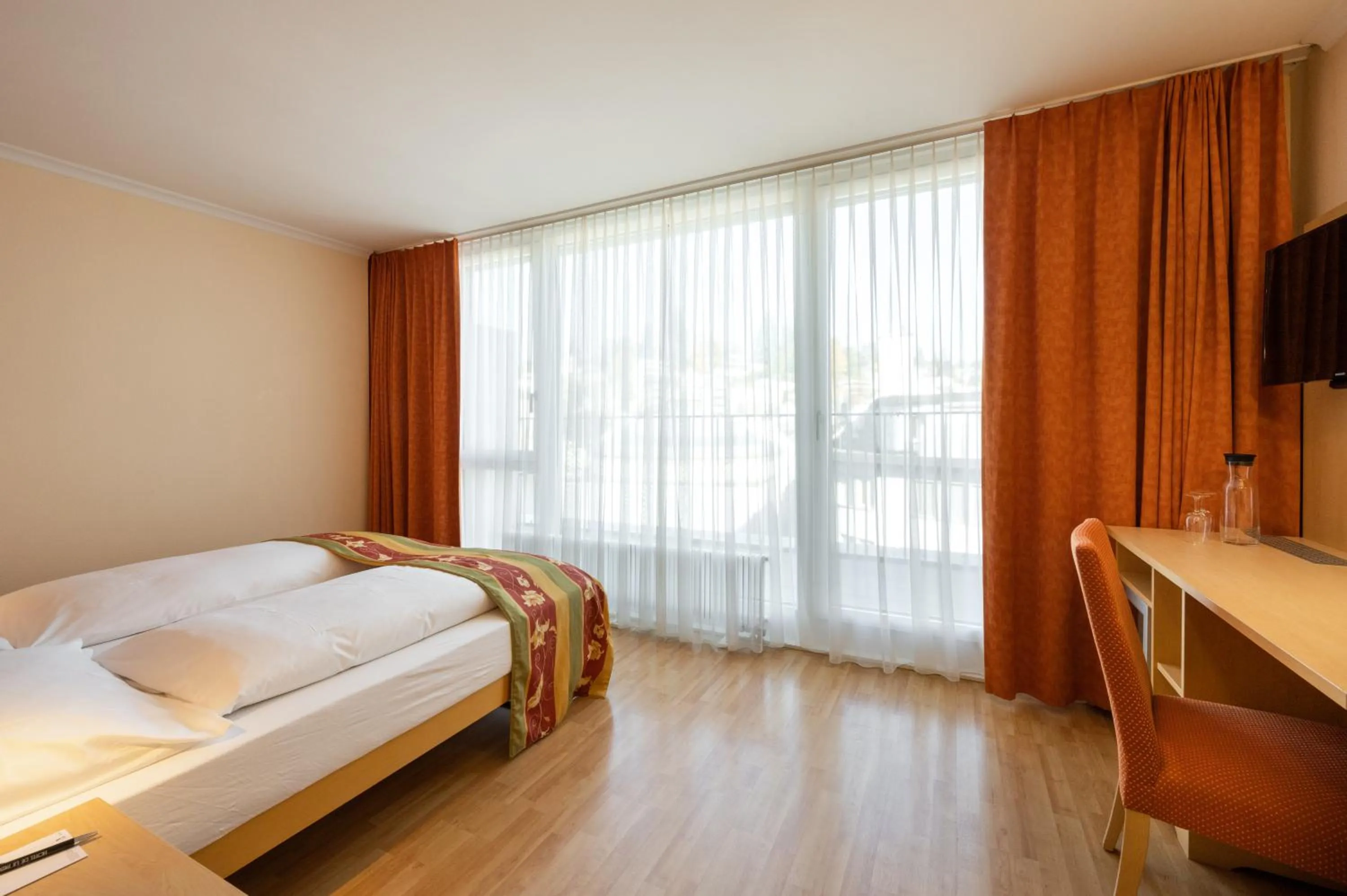 Living room, Bed in Ambassador Self Check-in Hotel