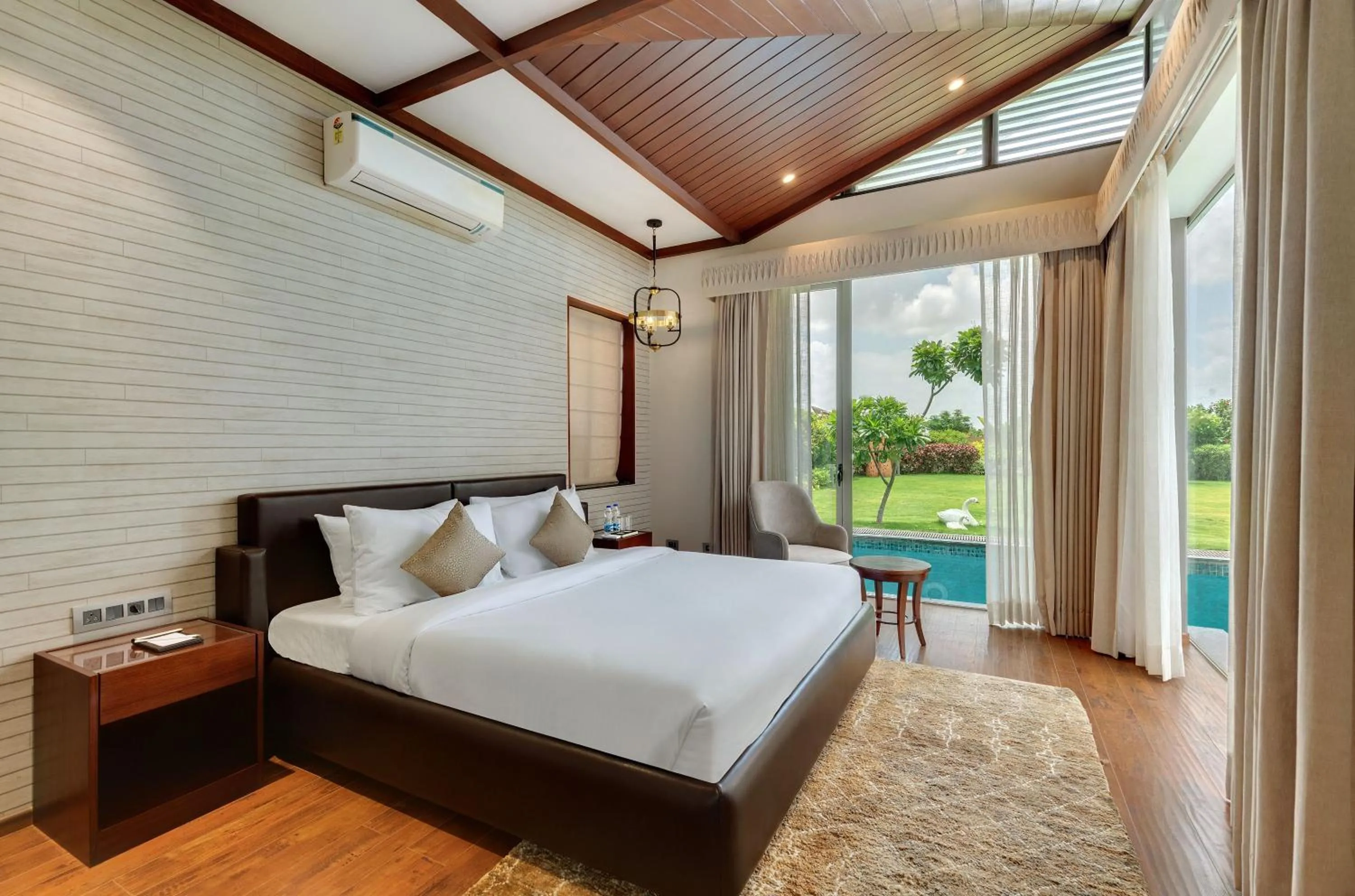 Bed in The Fern Royal Farm Resort, Anjar