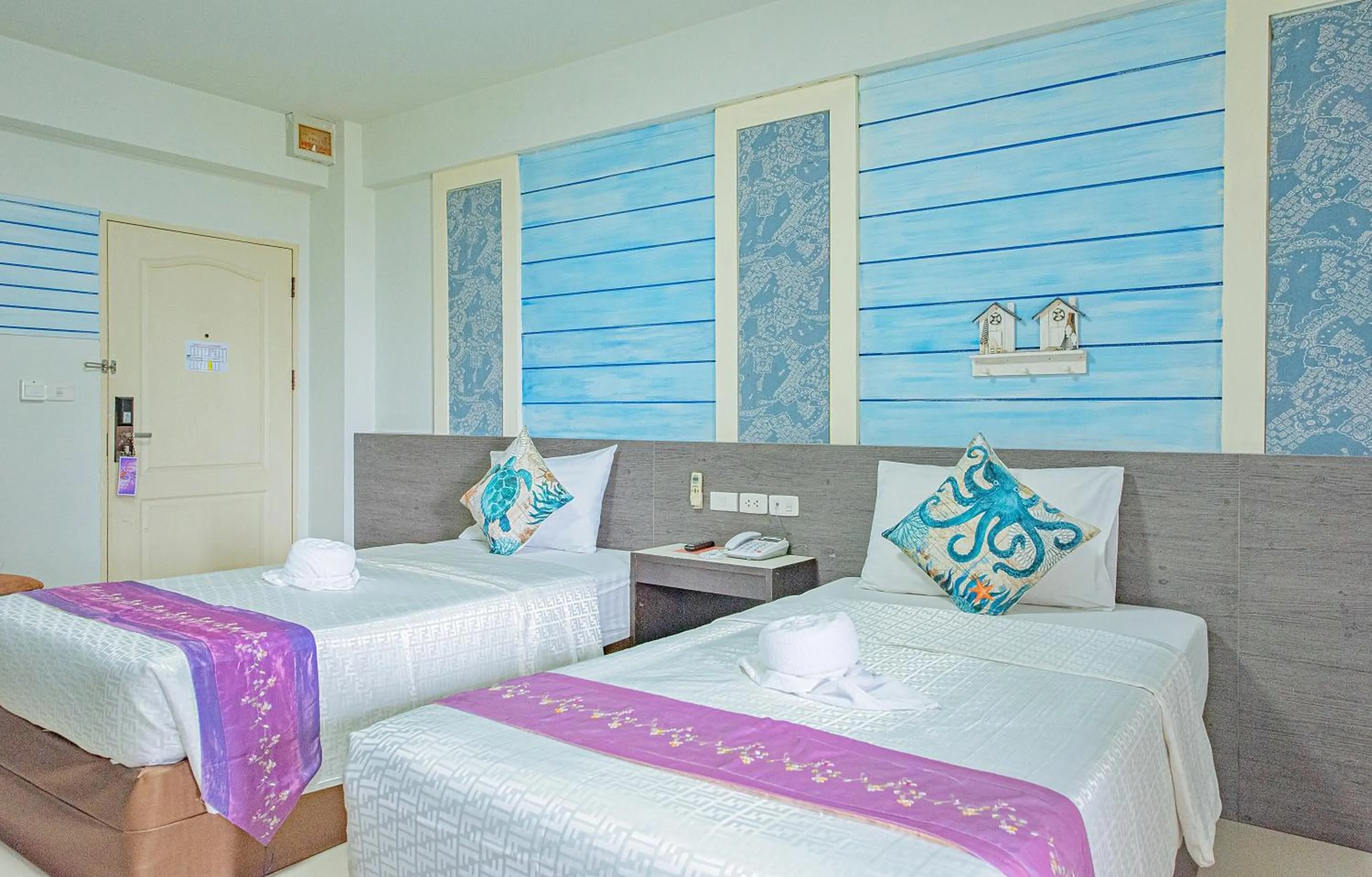 Bed in The Wing Design Hotel