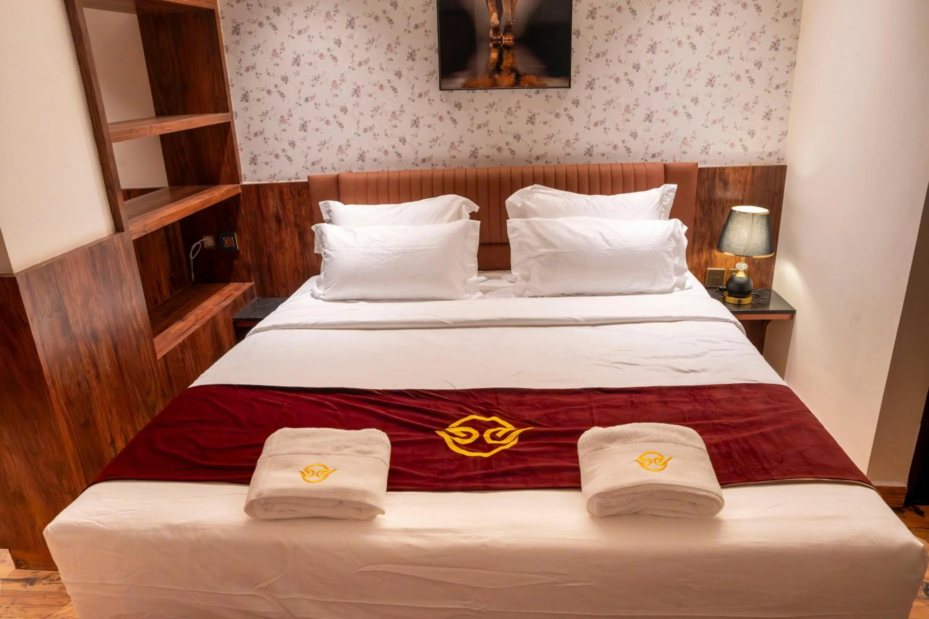 Bed in Hotel Golden Amulya Rest Wings