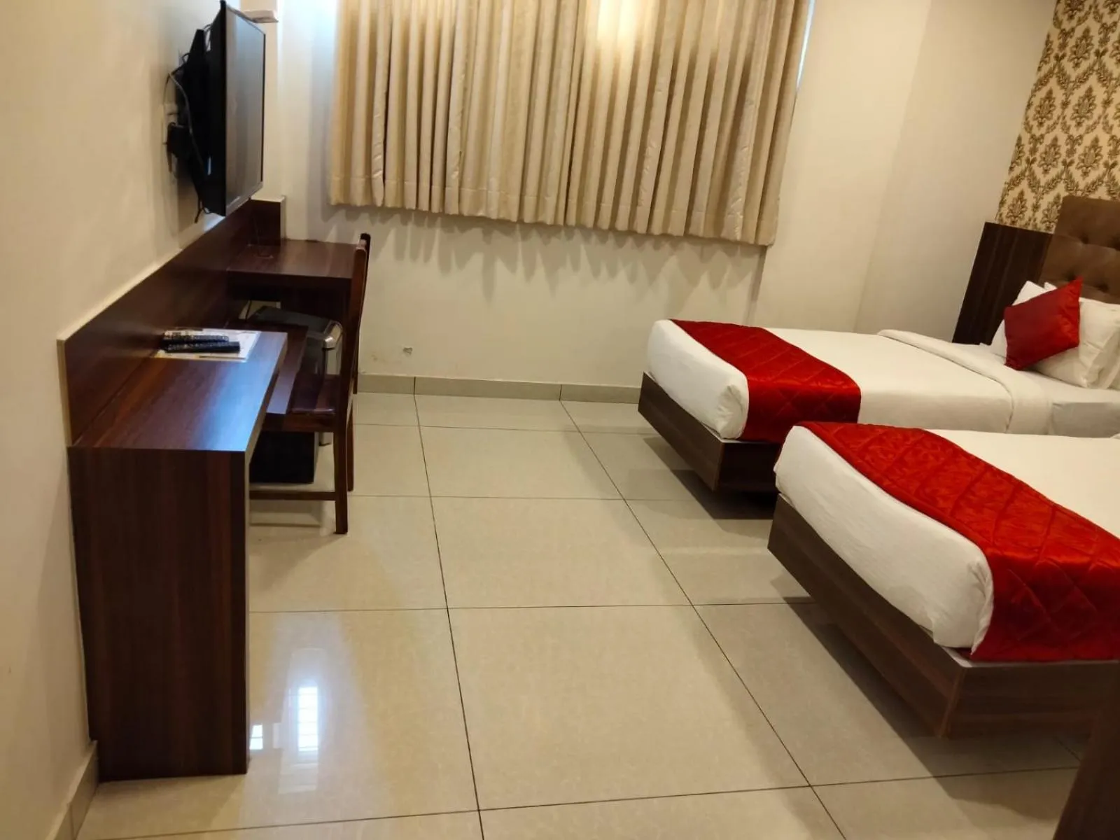 Bed in Hotel Golden Amulya Rest Wings