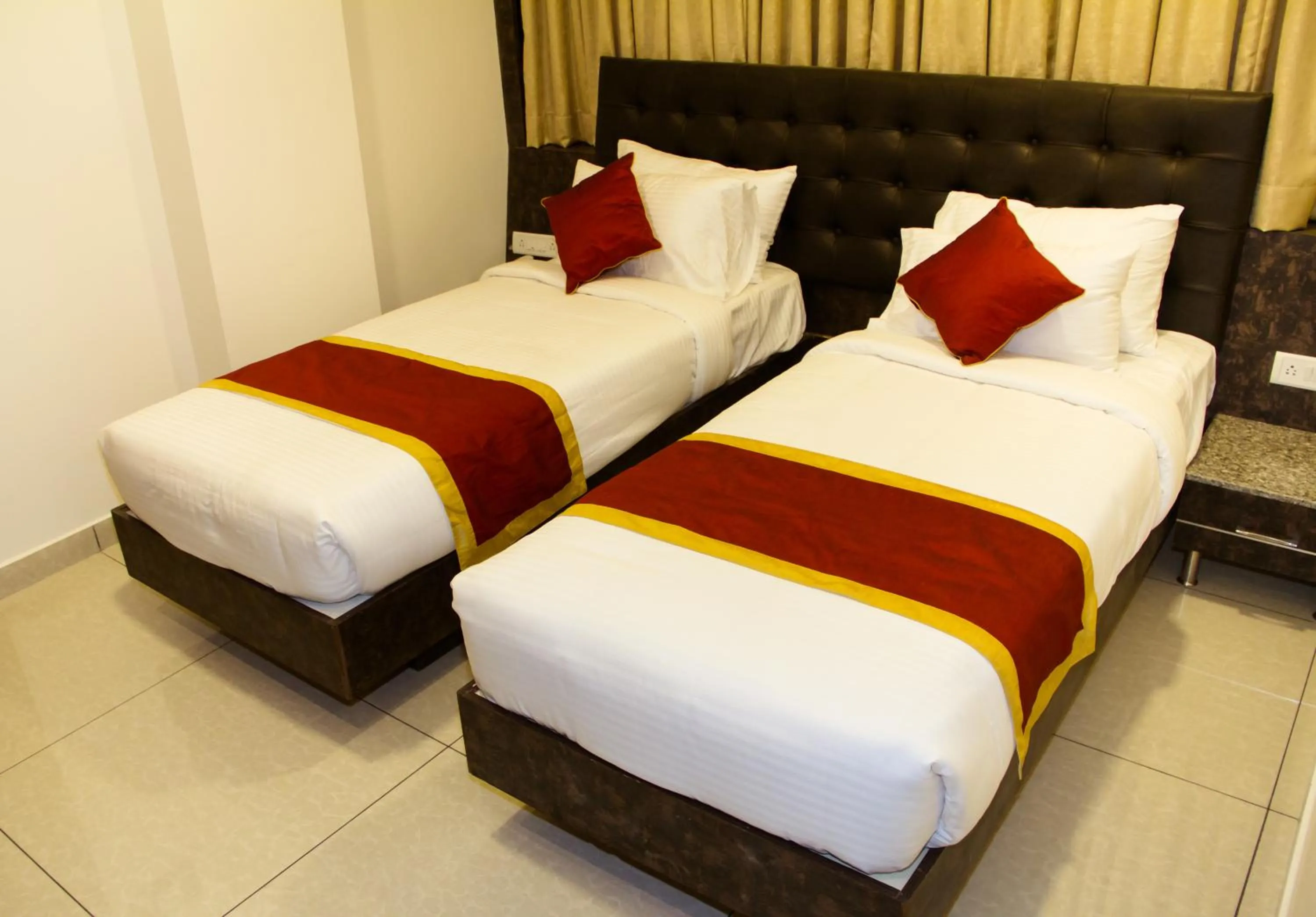 Bed in Hotel Golden Amulya Rest Wings
