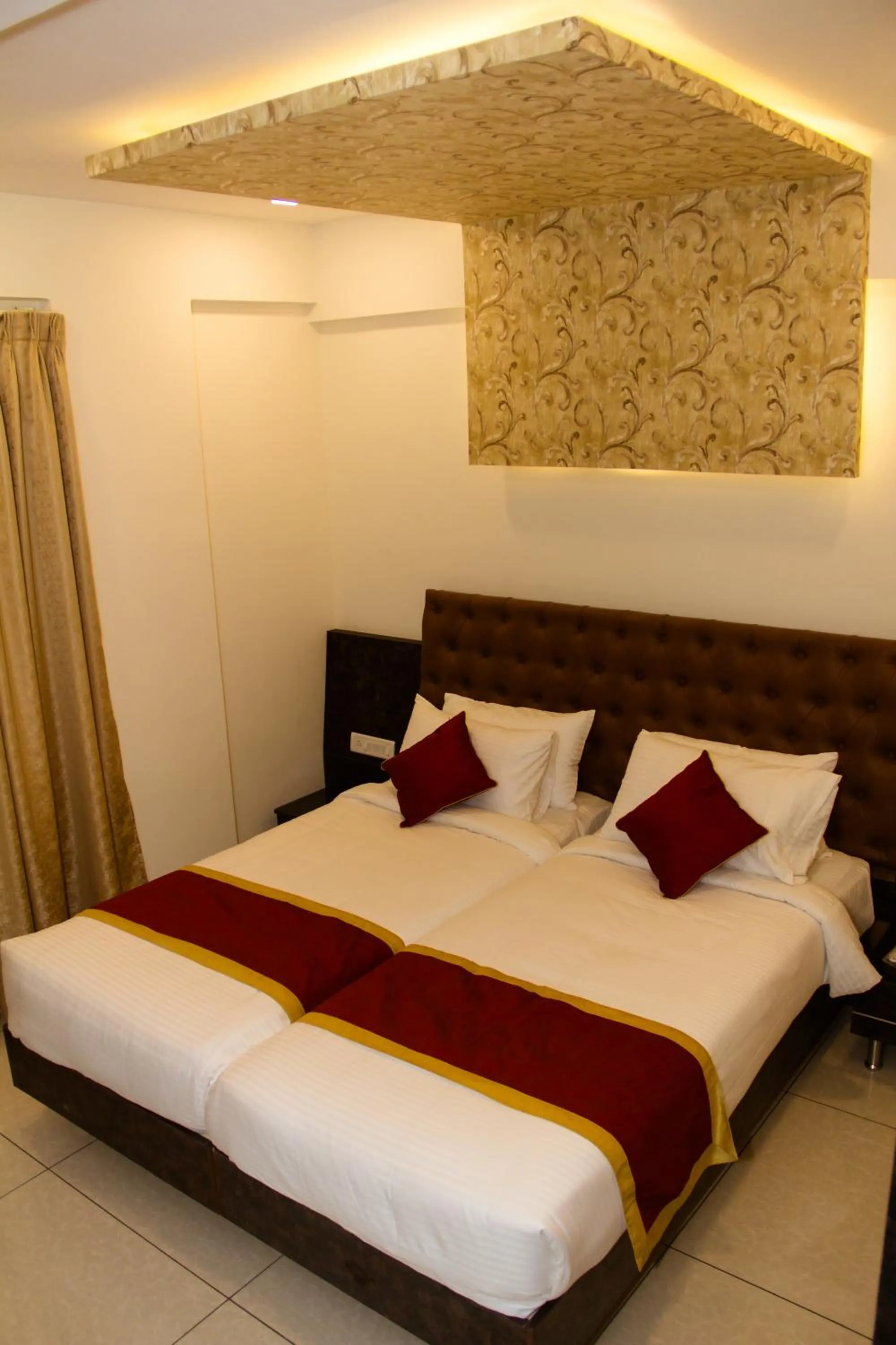 Bed in Hotel Golden Amulya Rest Wings
