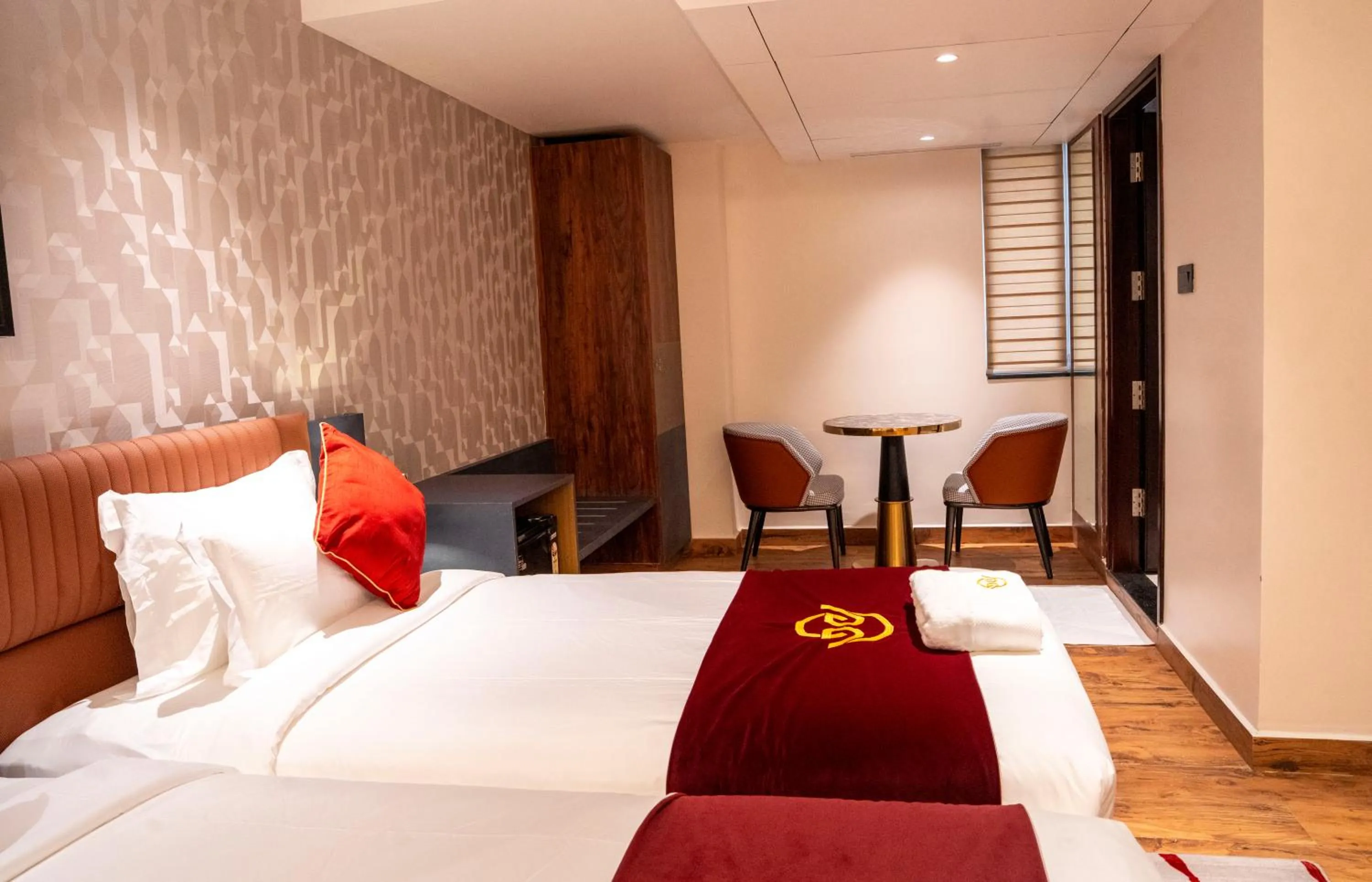 Bed in Hotel Golden Amulya Rest Wings
