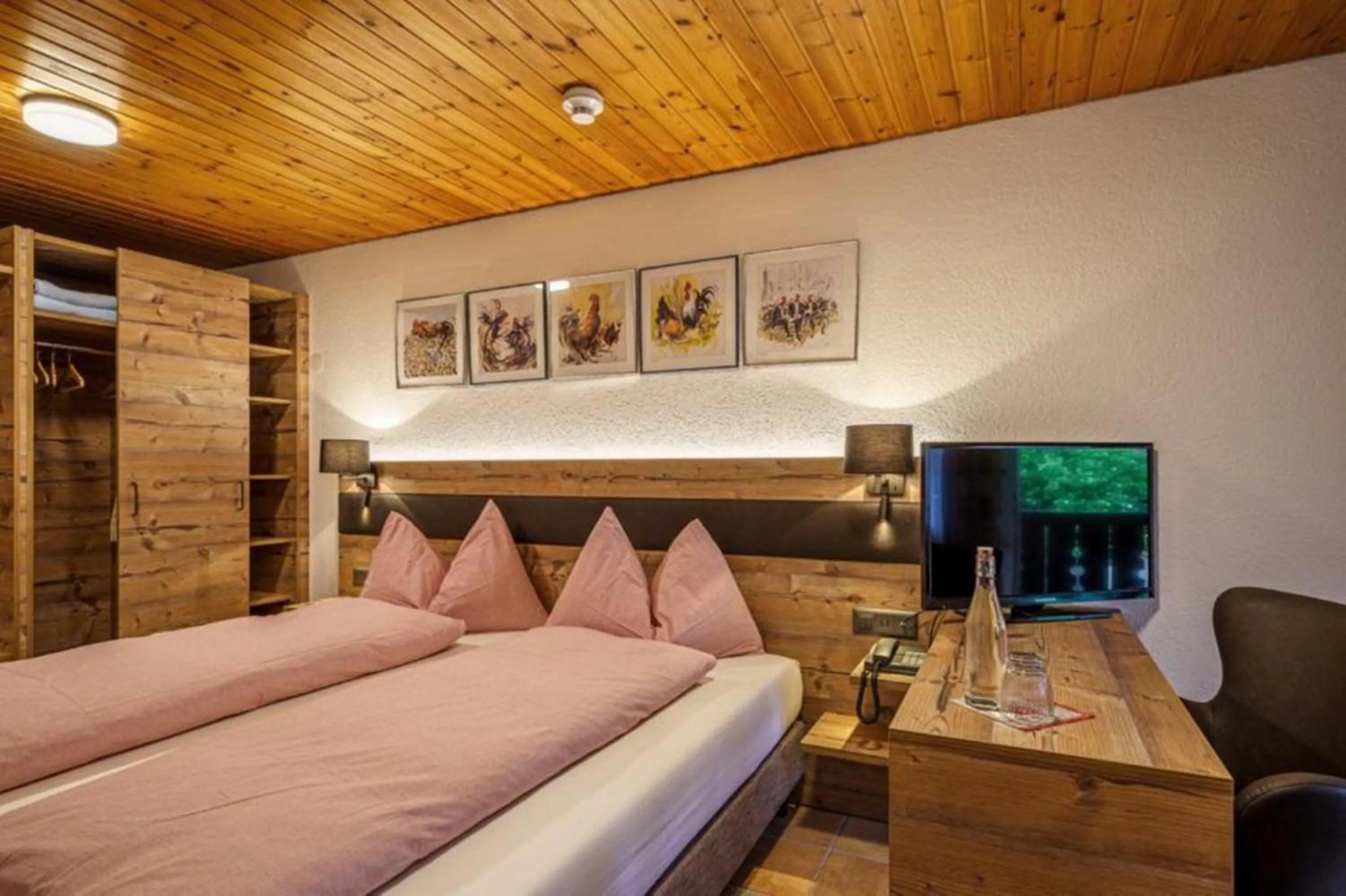 Photo of the whole room, Bed in Alpenblick Hotel & Restaurant Wilderswil by Interlaken