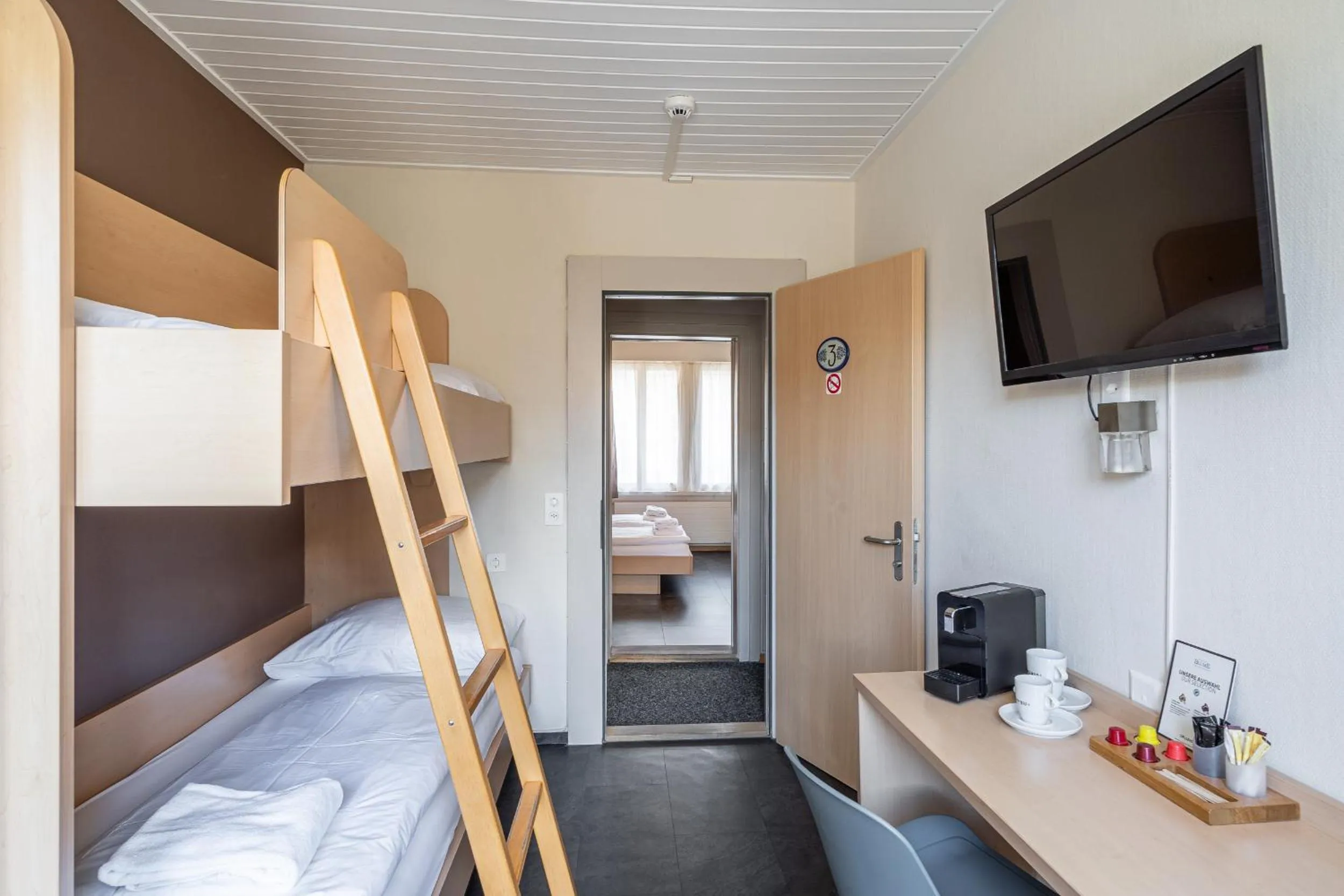 Bed in Hotel Blume Interlaken