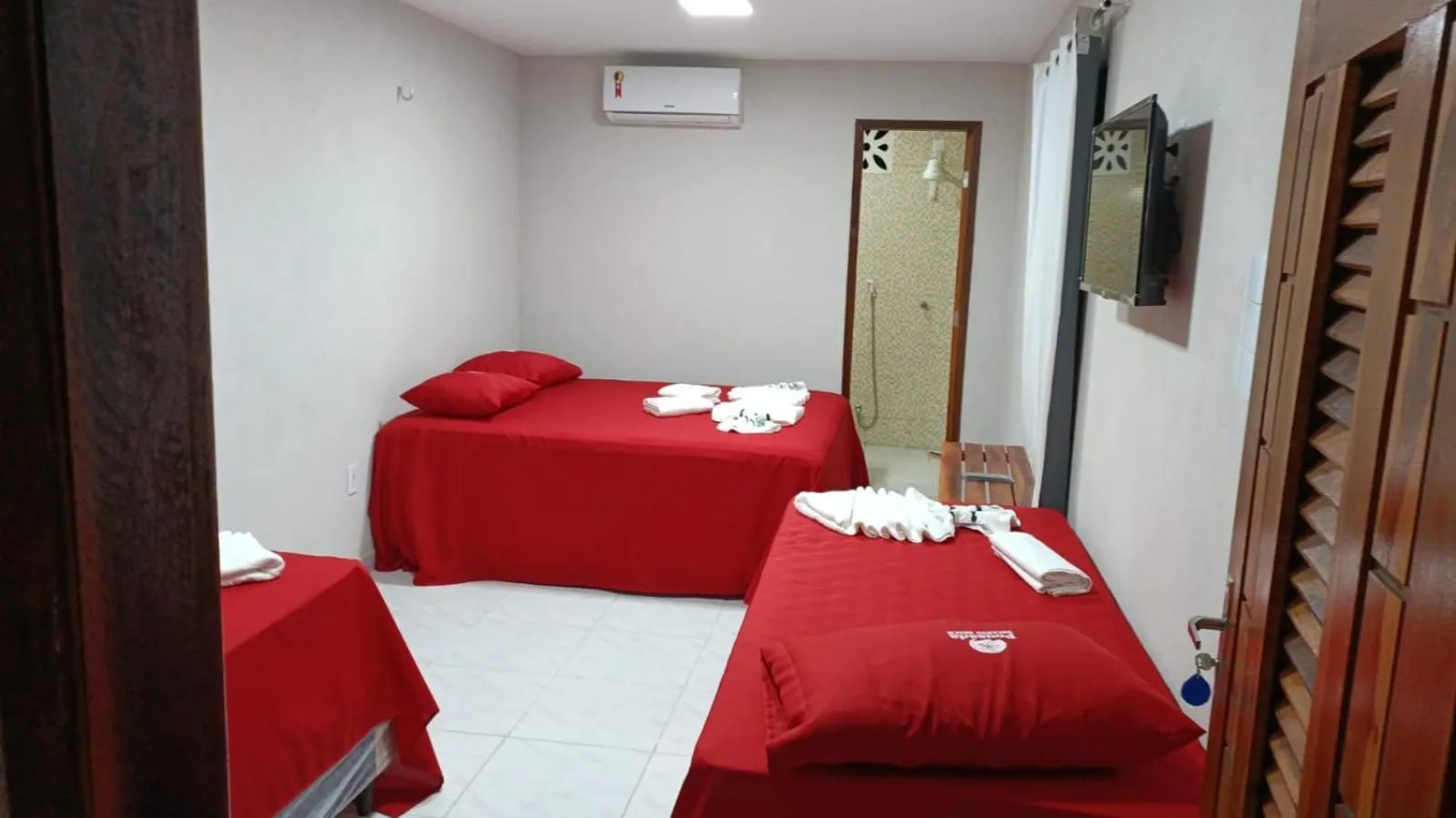 Bed in Pousada Recanto Beach