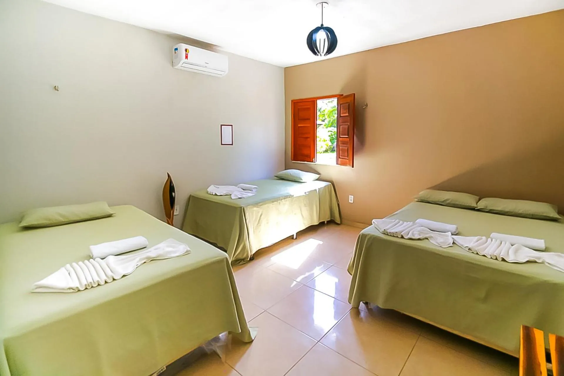 Bed in Pousada Recanto Beach