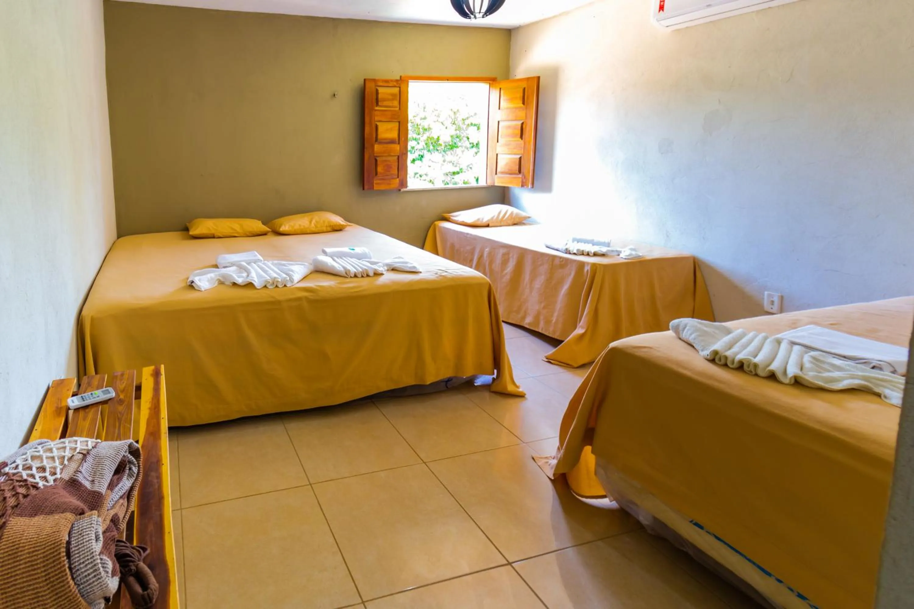 Bed in Pousada Recanto Beach