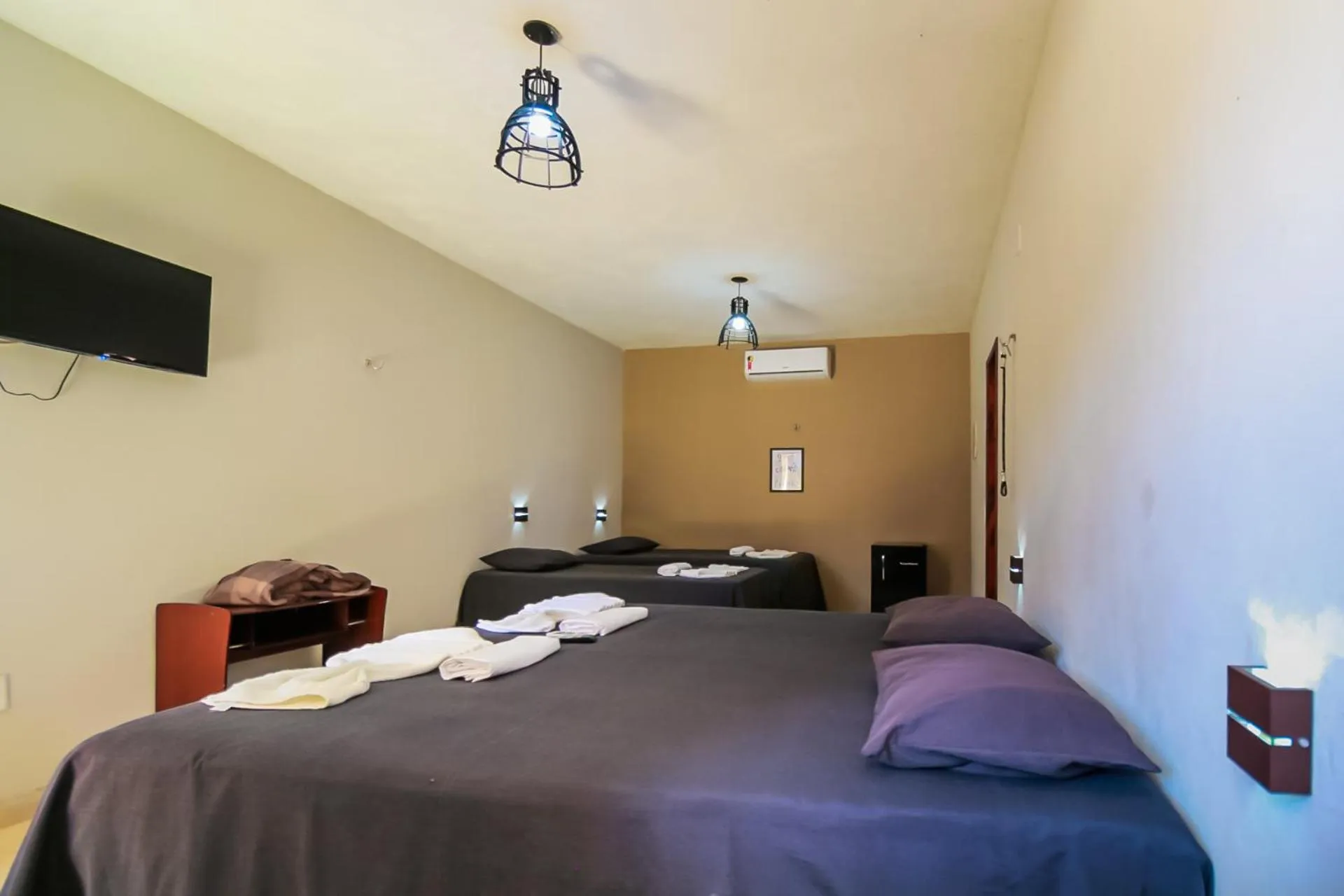 Bed in Pousada Recanto Beach