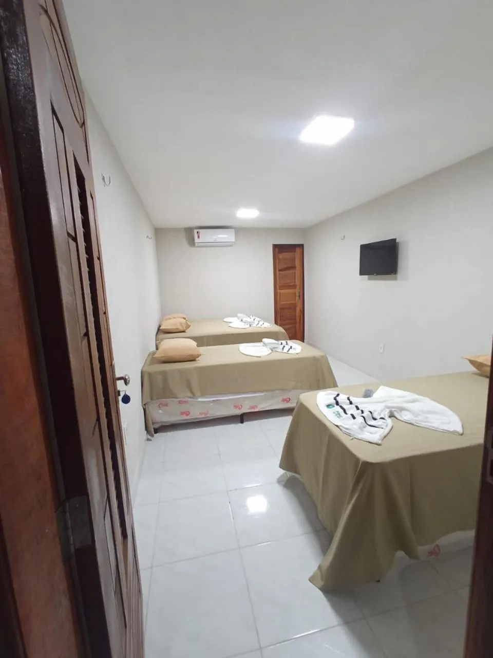 Bed in Pousada Recanto Beach