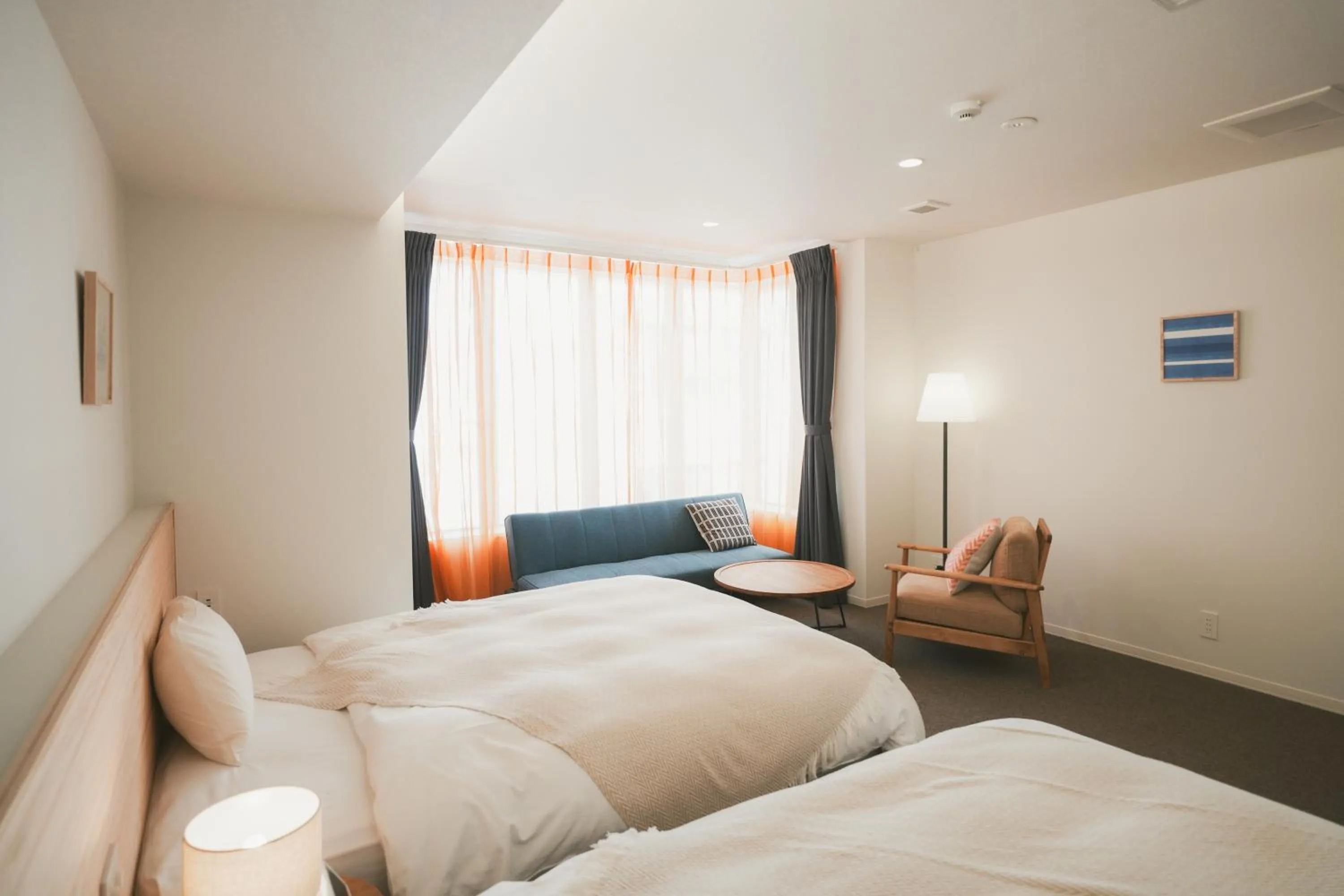 Photo of the whole room, Bed in NAGI Hiroshima Hotel and Lounge