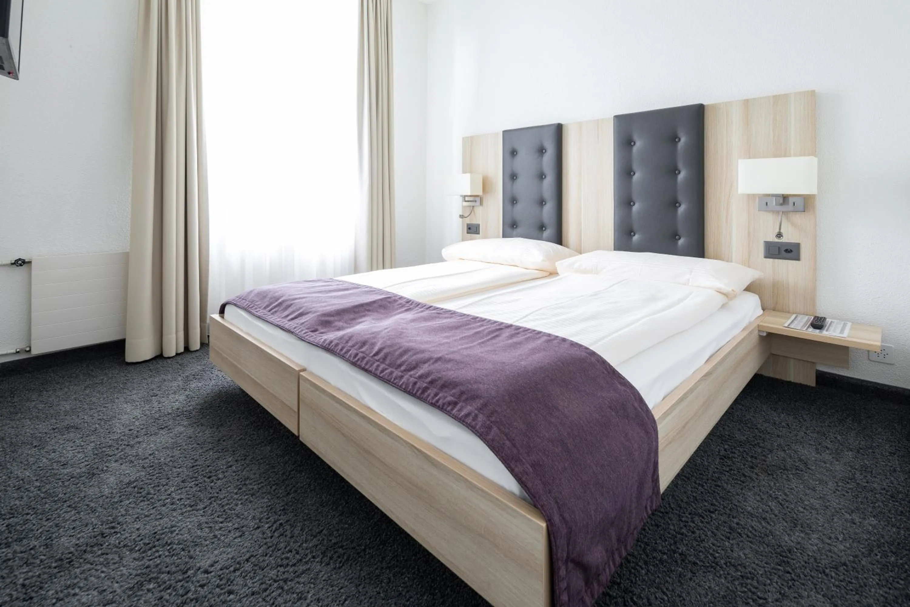 Photo of the whole room, Bed in Hotel Lötschberg