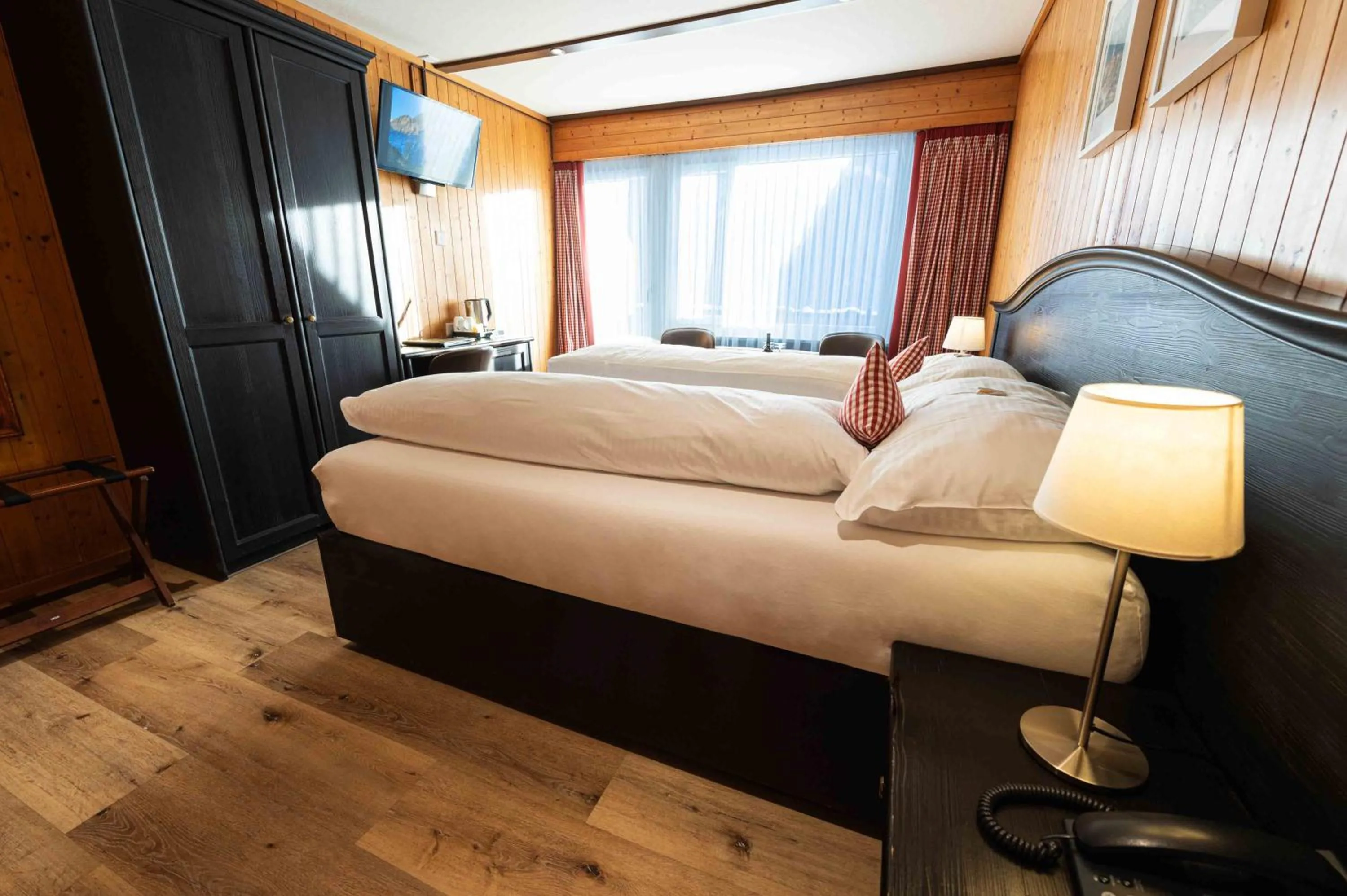 Living room, Bed in Hotel Bernerhof Grindelwald