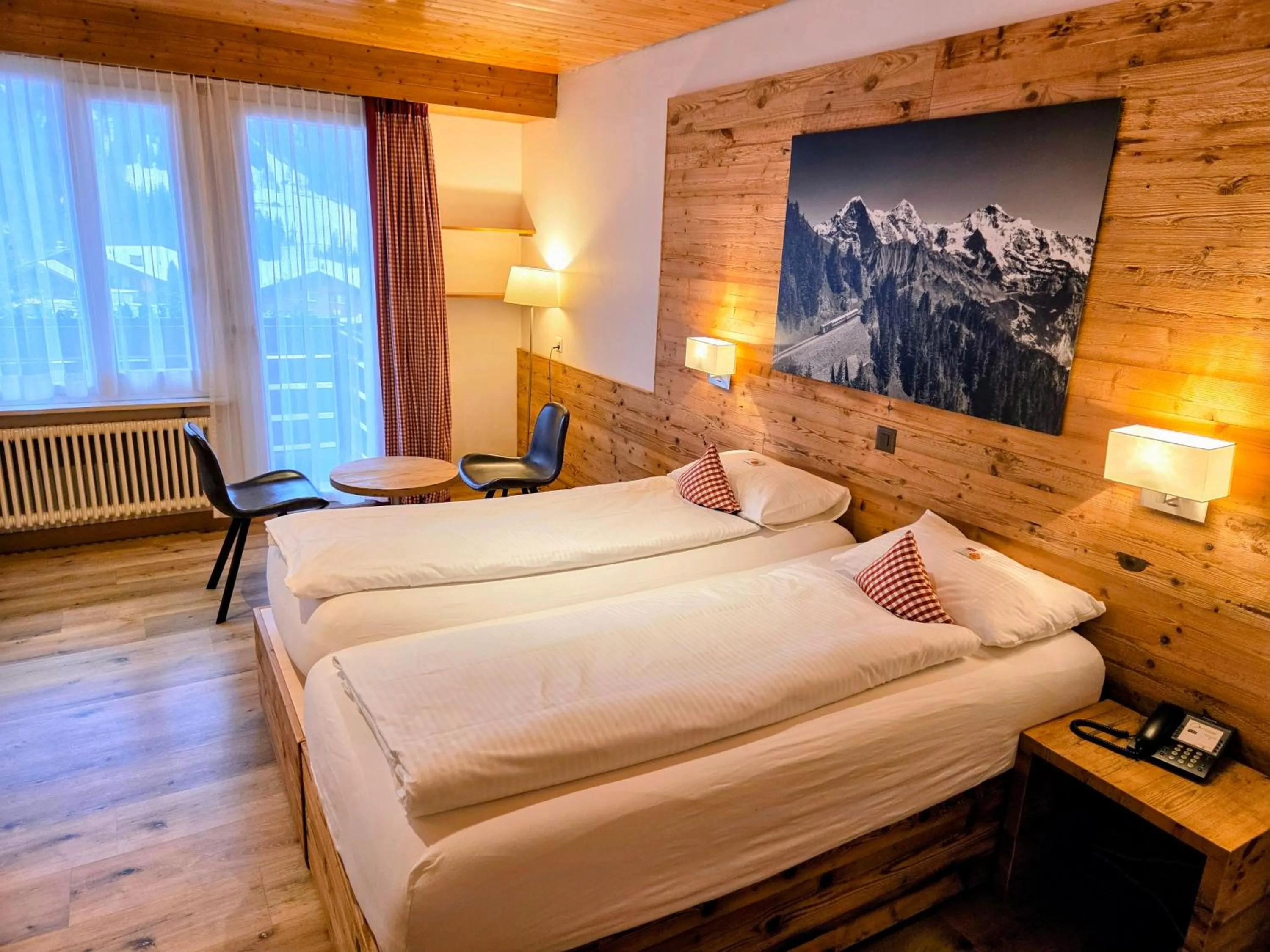Photo of the whole room, Bed in Hotel Bernerhof Grindelwald