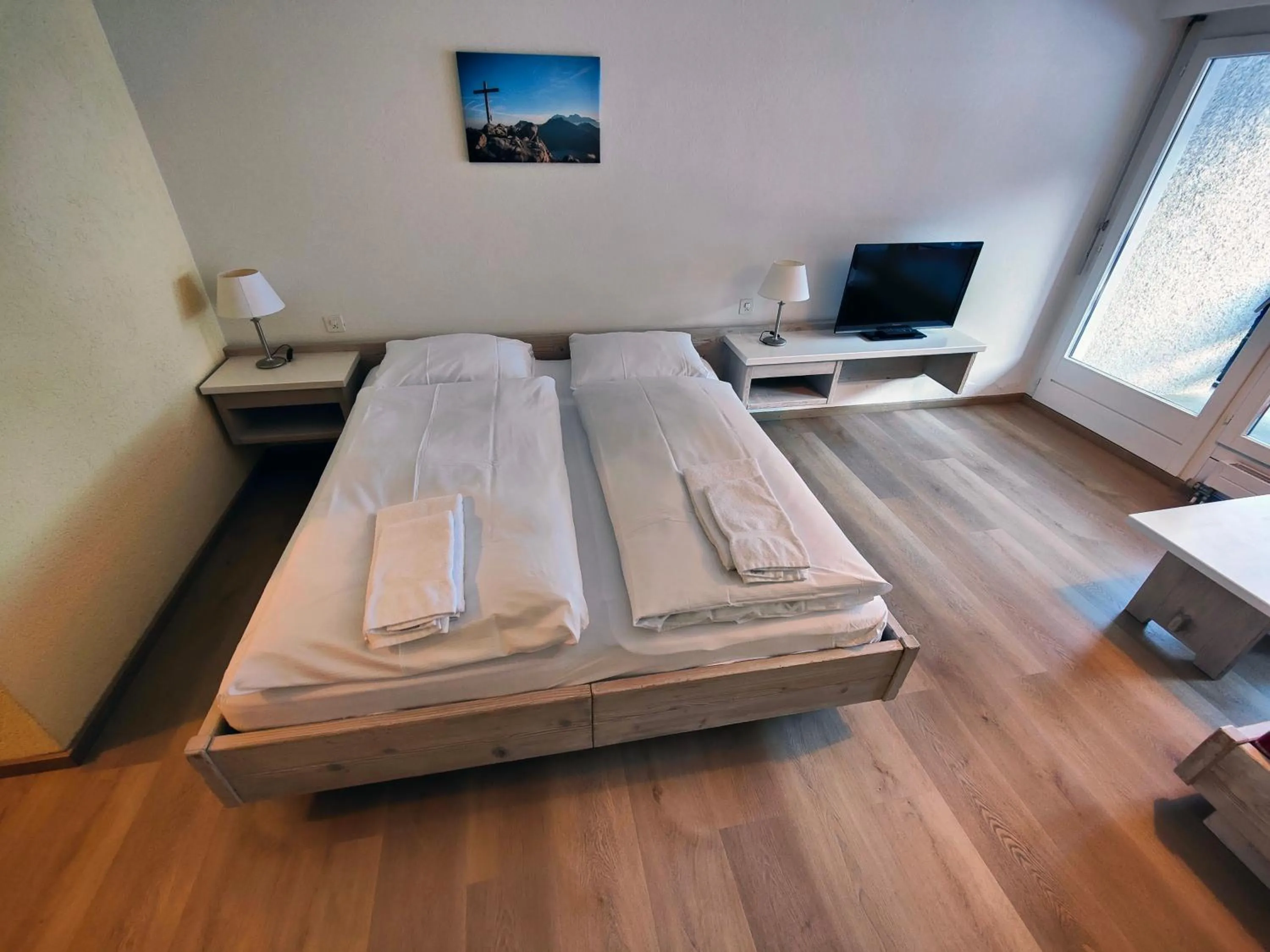 Photo of the whole room, Bed in Hotel Säntis Lodge