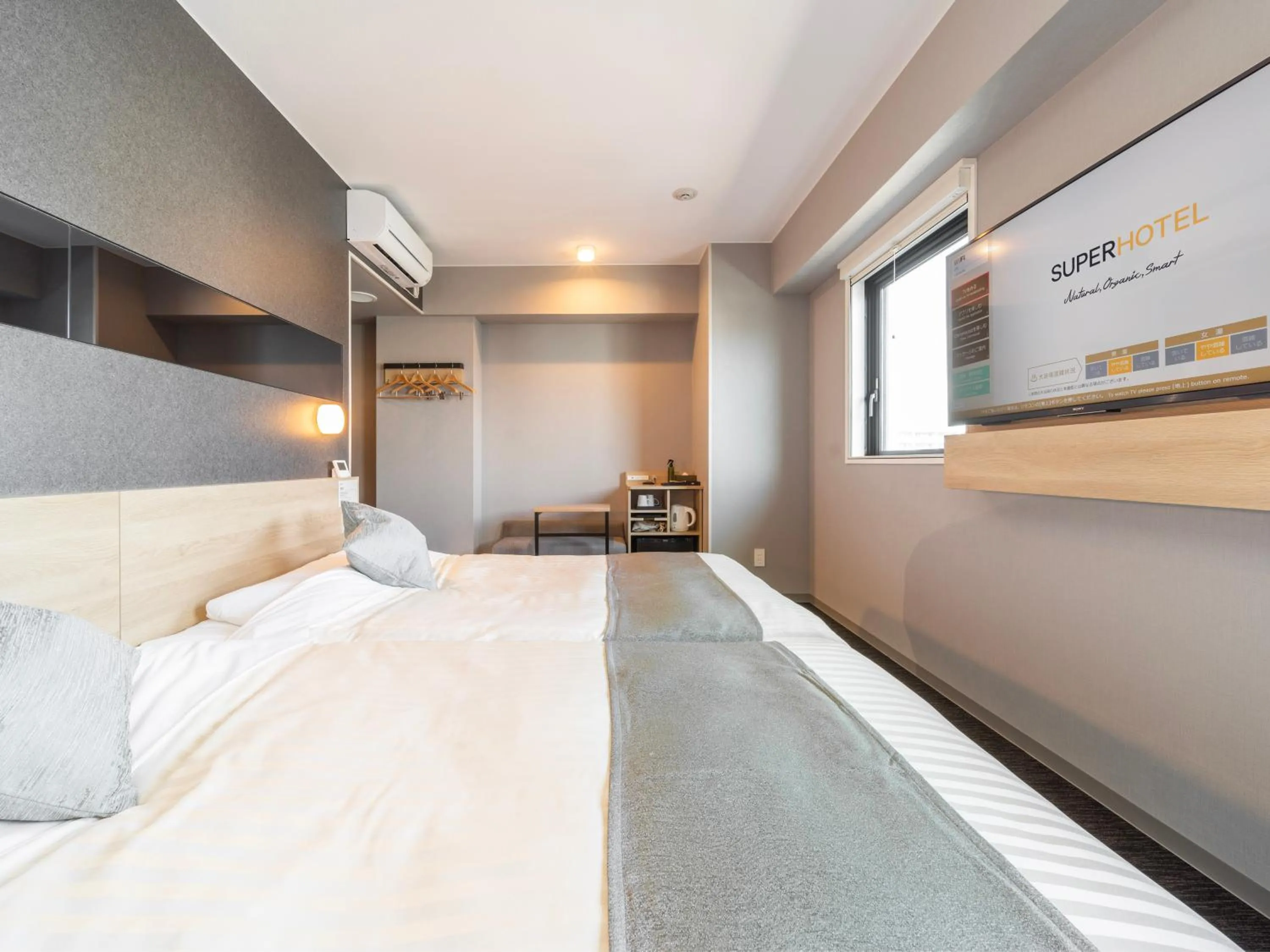 Bed in Super Hotel Premier Kanazawaeki Higashiguchi