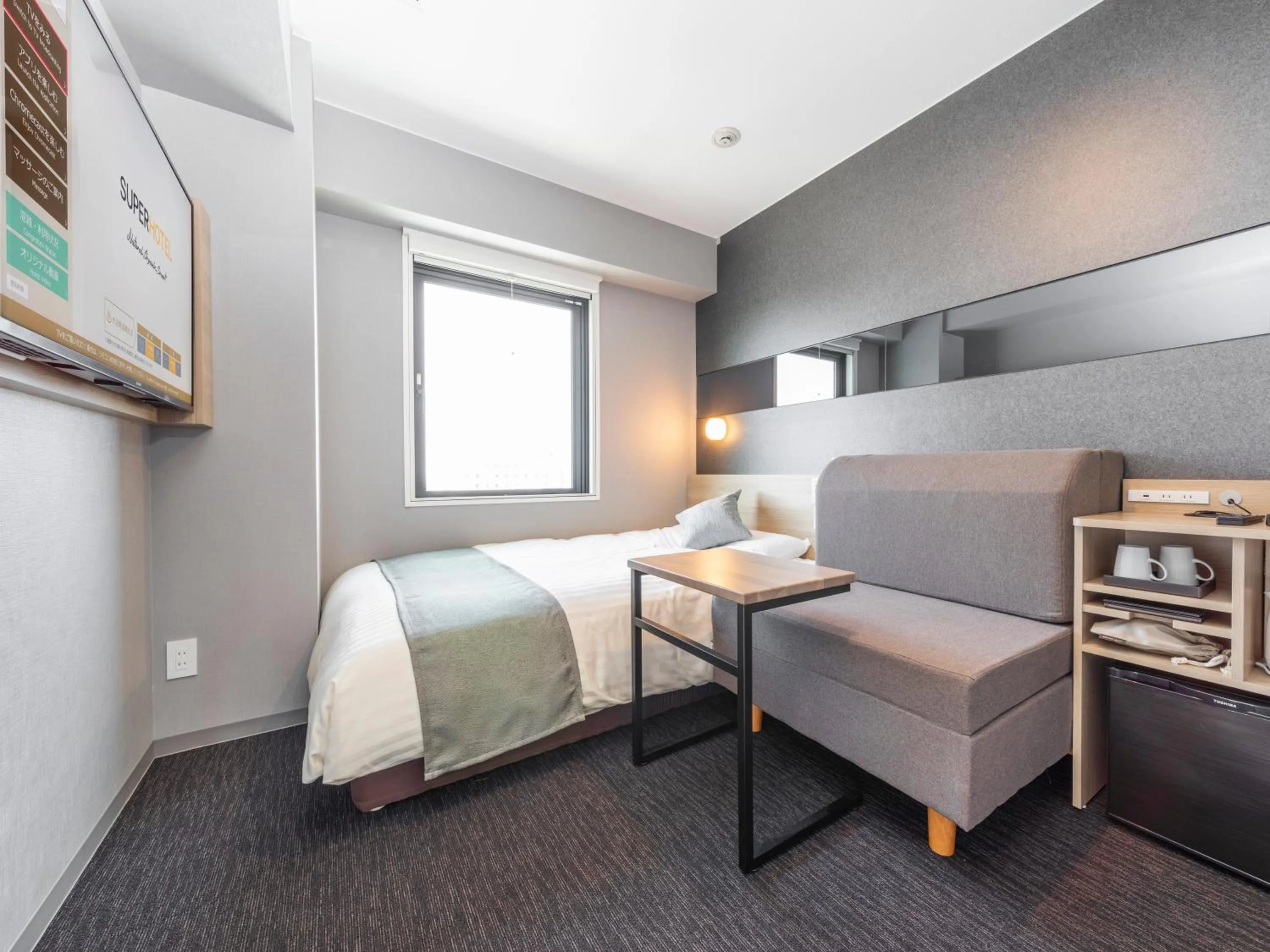 Bed in Super Hotel Premier Kanazawaeki Higashiguchi