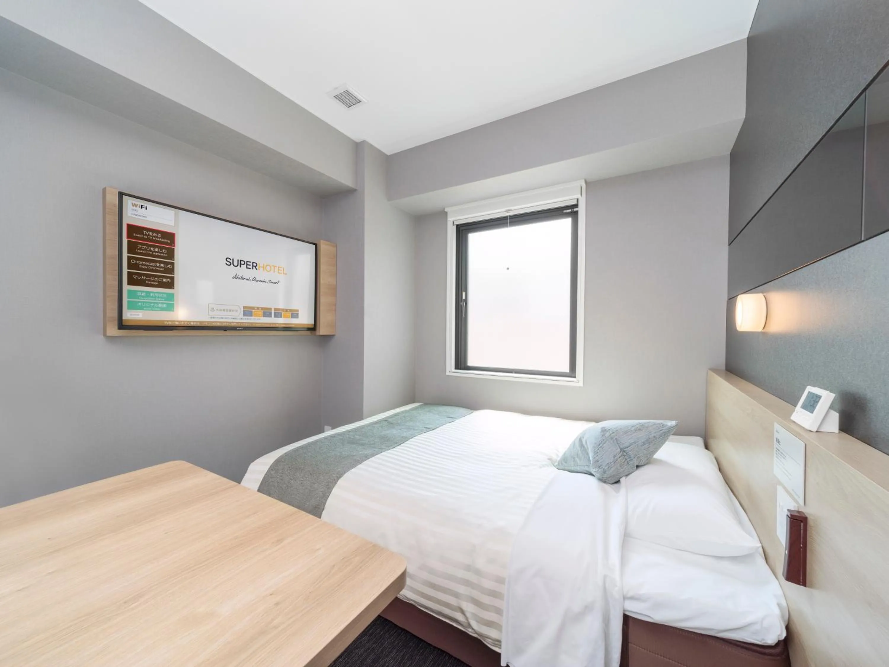 Bed in Super Hotel Premier Kanazawaeki Higashiguchi