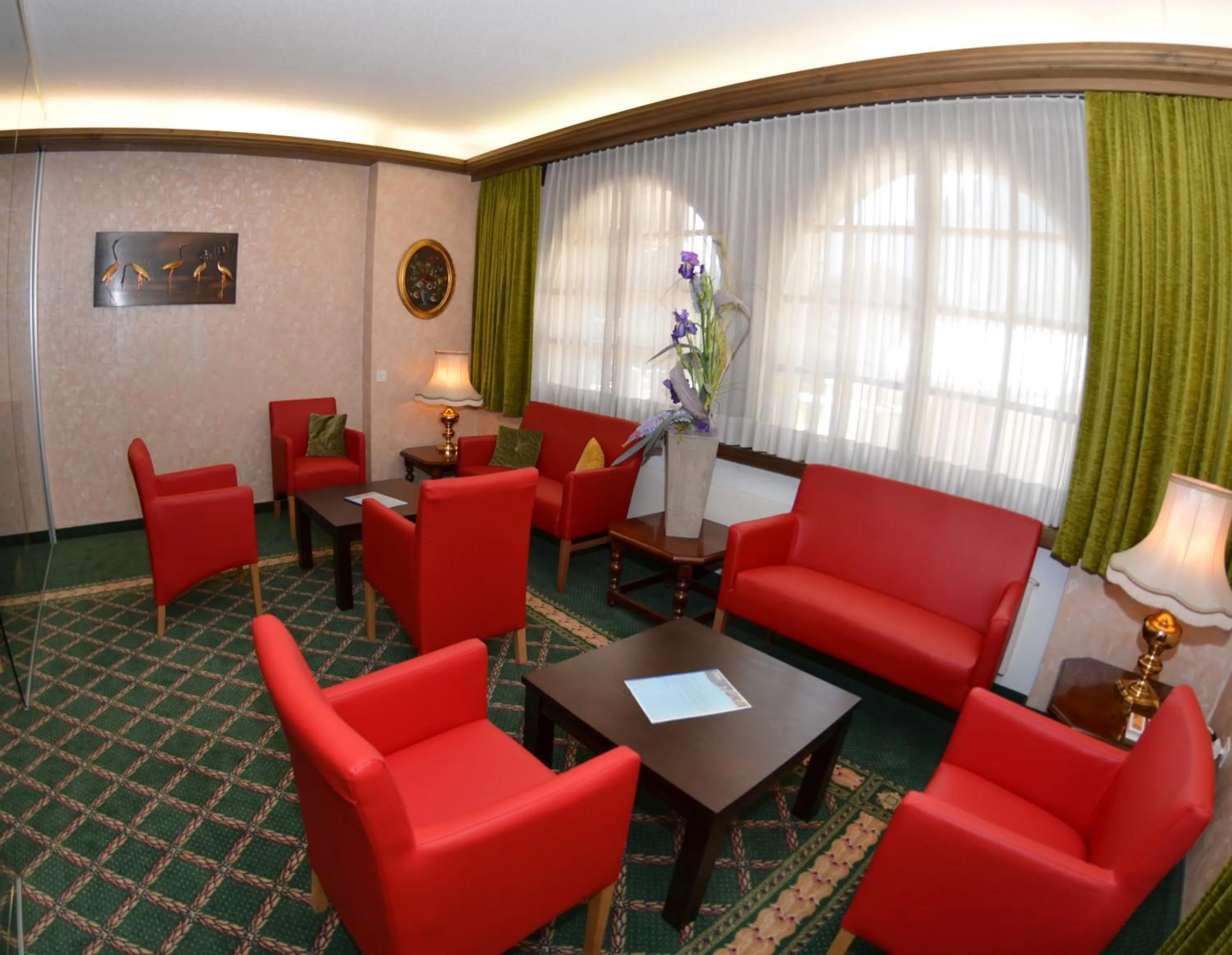 Communal lounge/ TV room in Hotel Alex