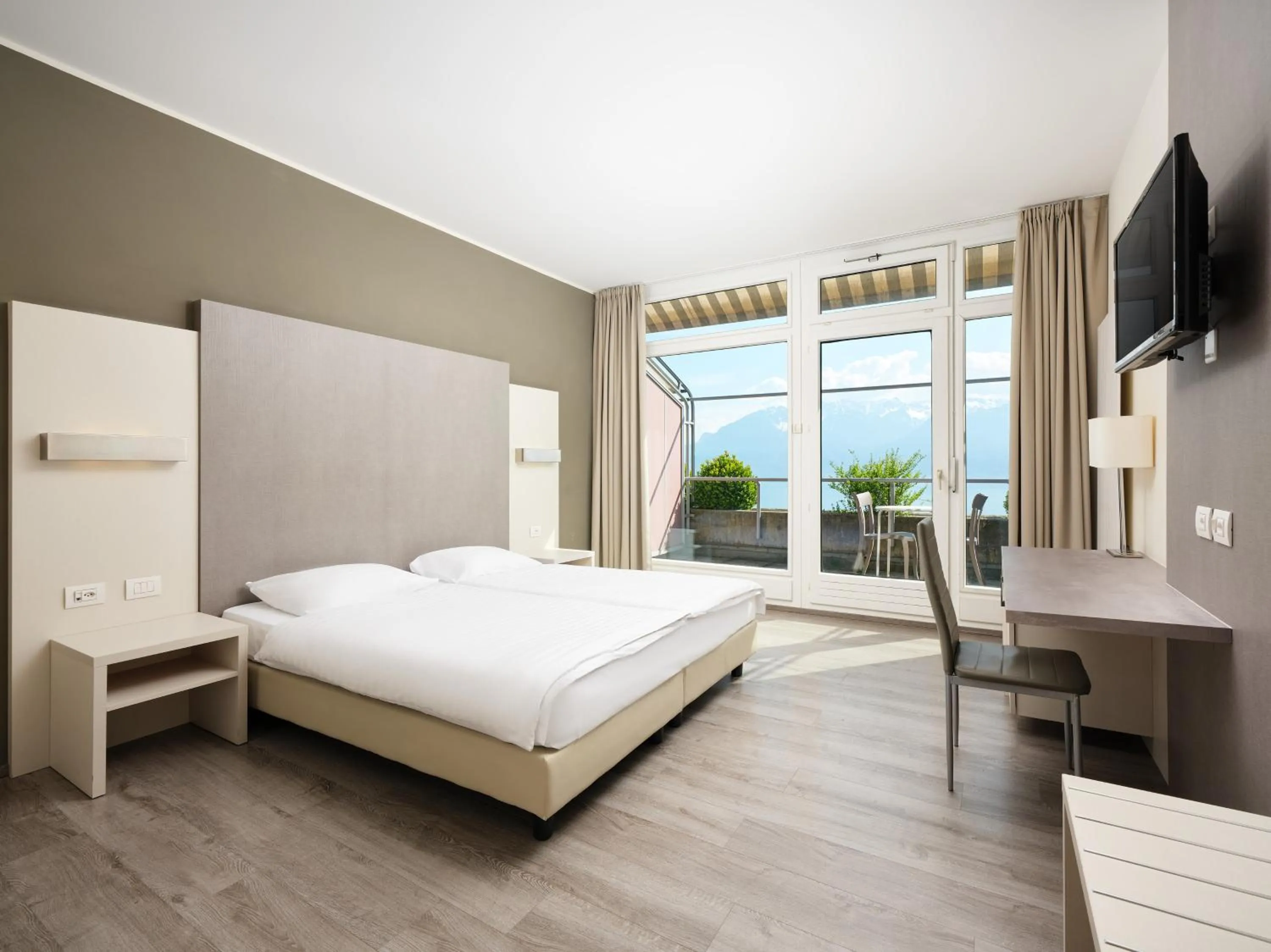 Bed in Hôtel Prealpina