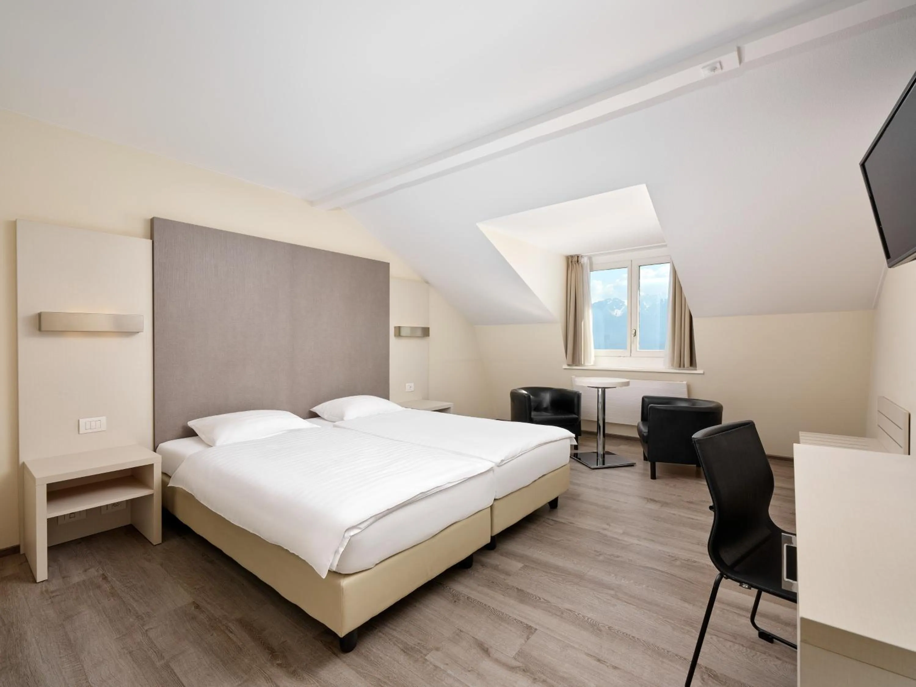 Bed in Hôtel Prealpina