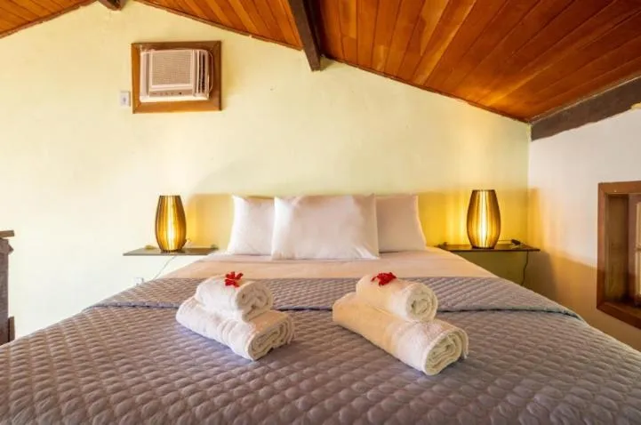 Bed in Pousada Cruzoé