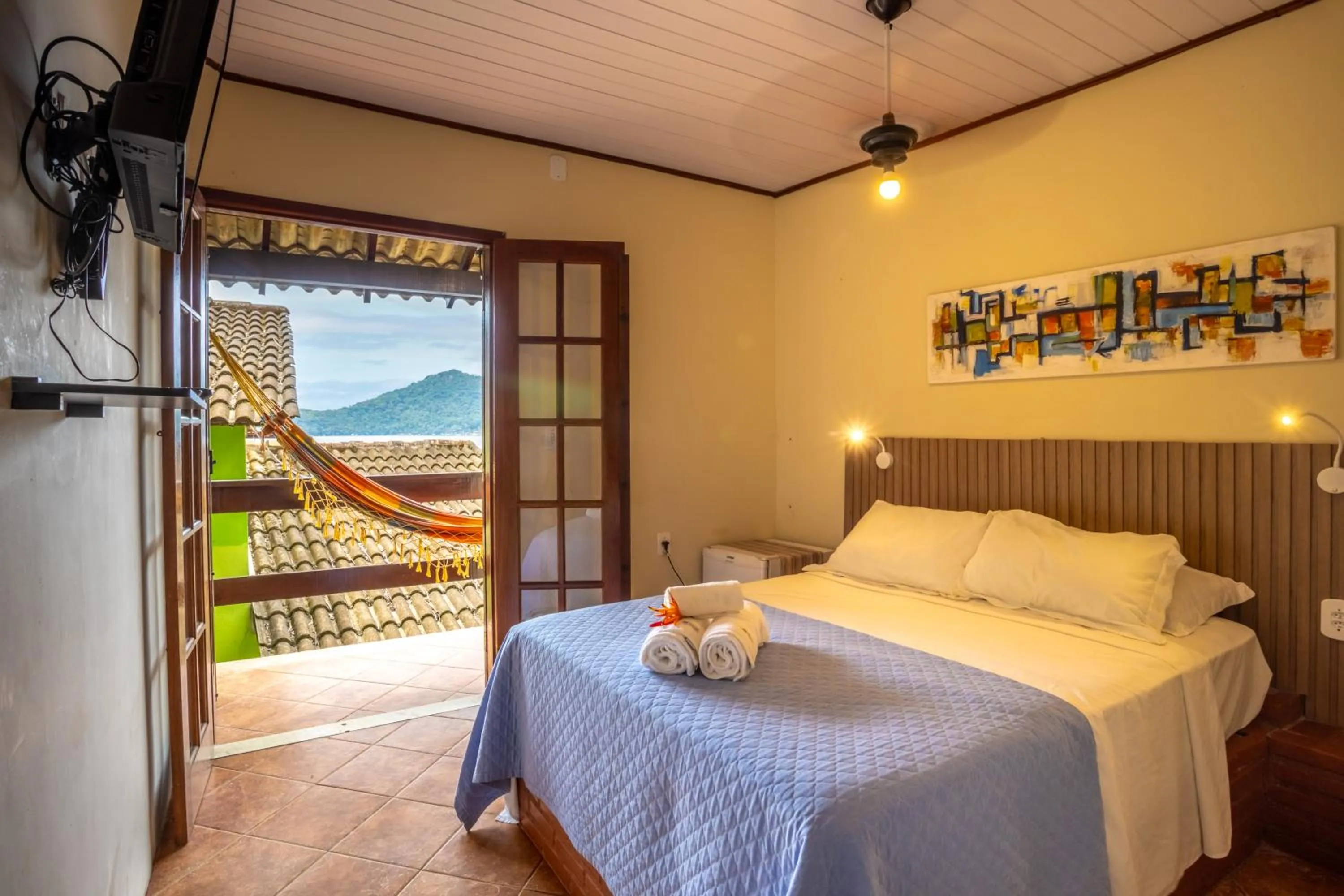 Bed in Pousada Cruzoé