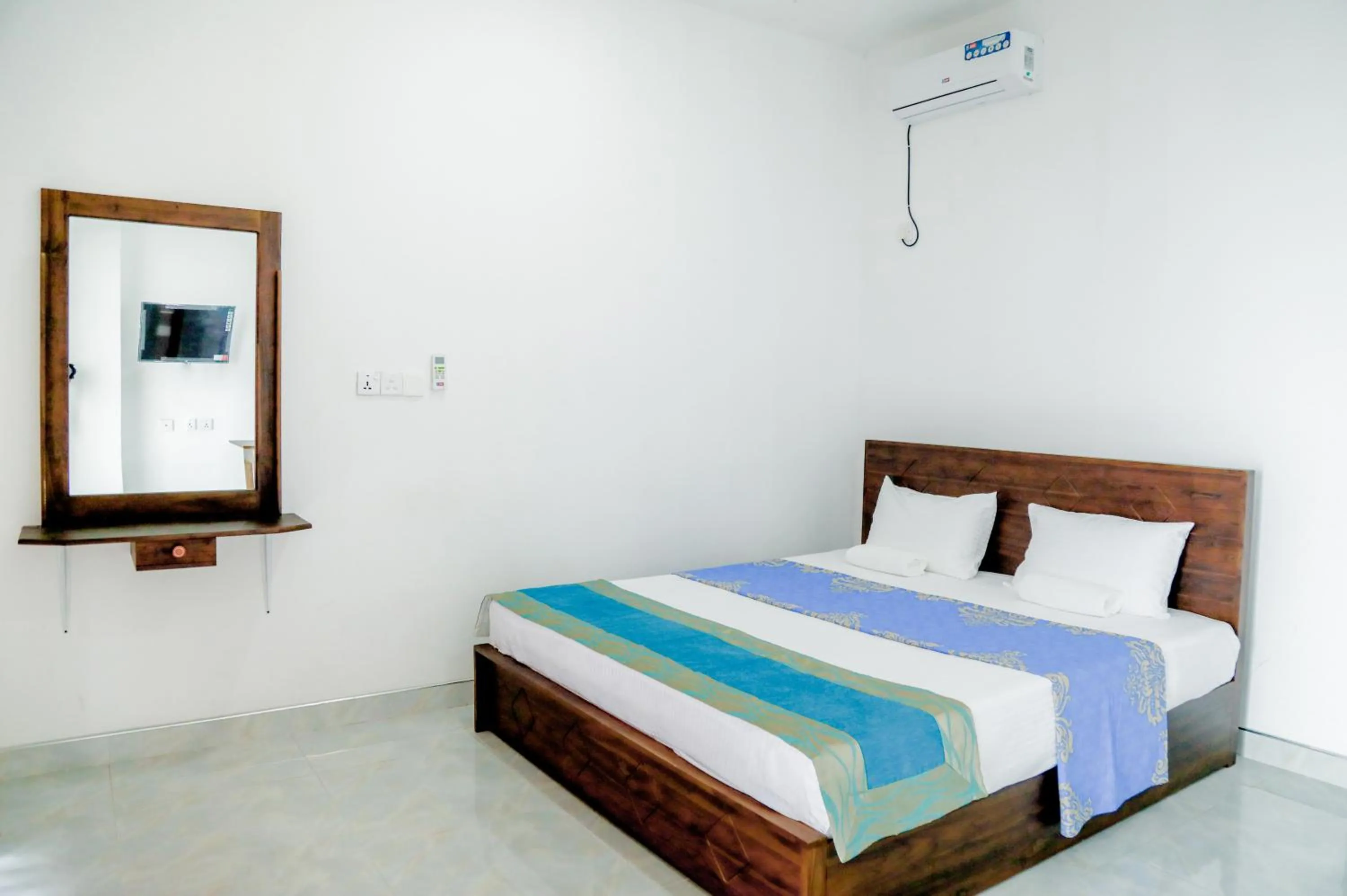 Bed in Araliya Lagoon Park Resort