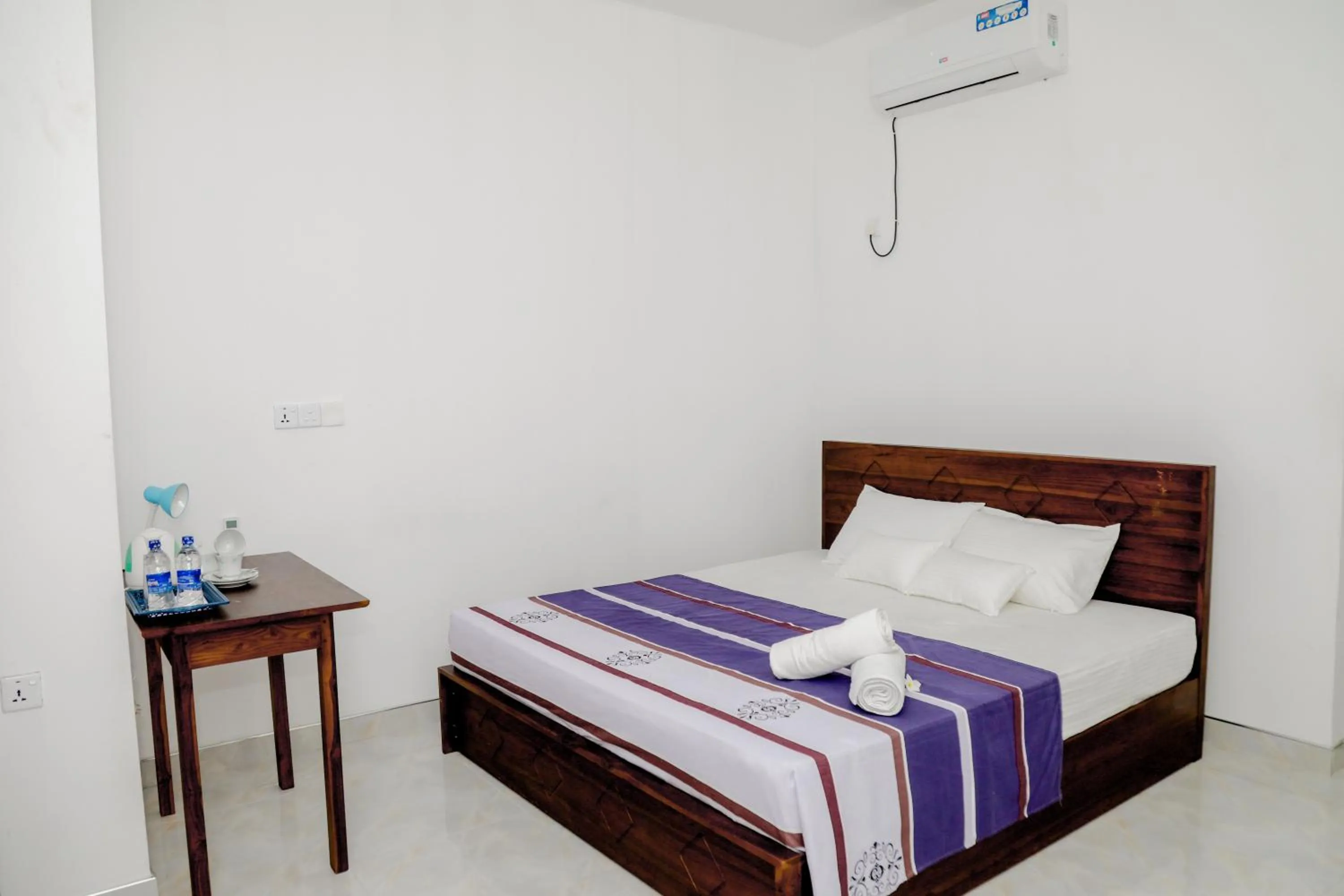 Bed in Araliya Lagoon Park Resort