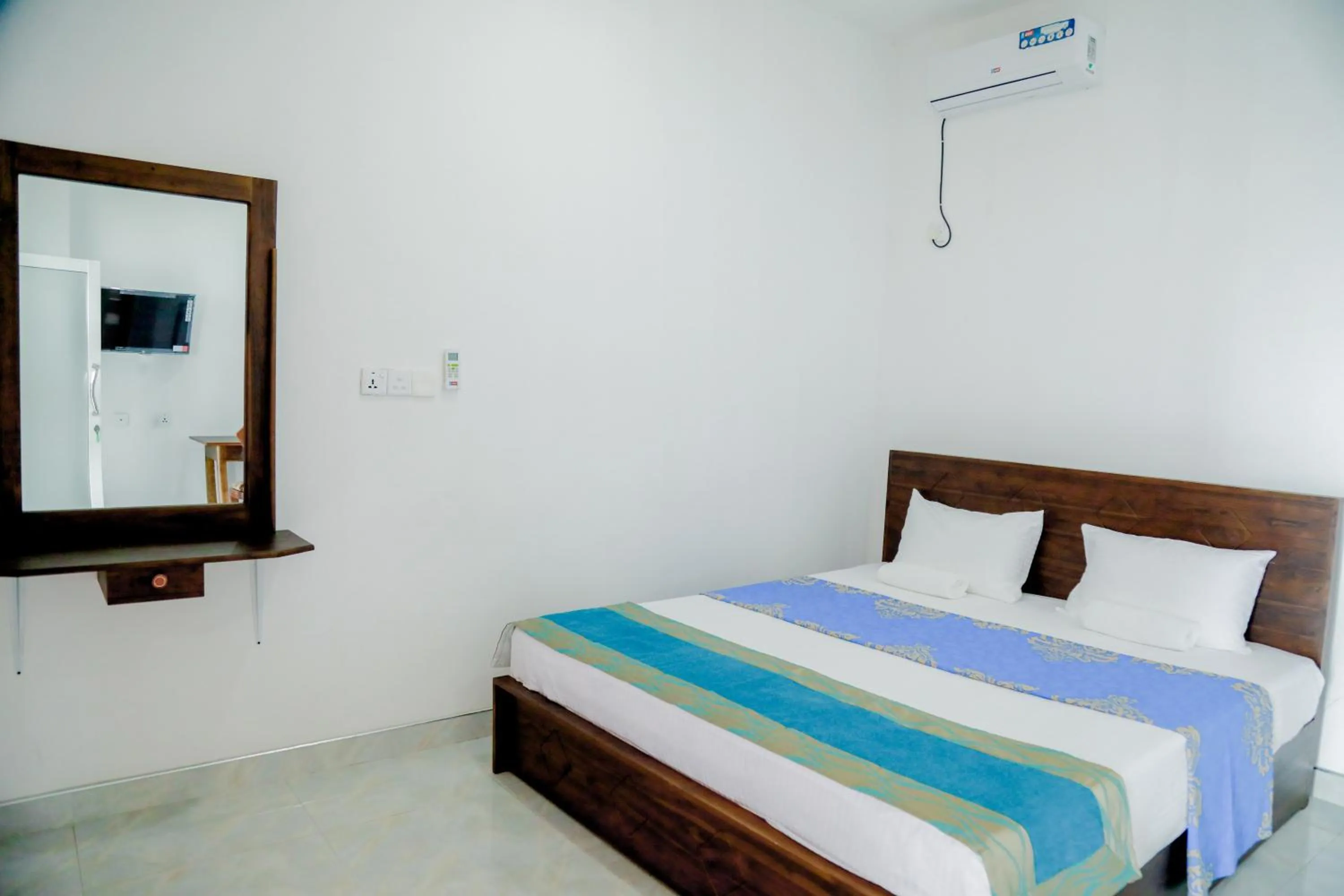 Bed in Araliya Lagoon Park Resort