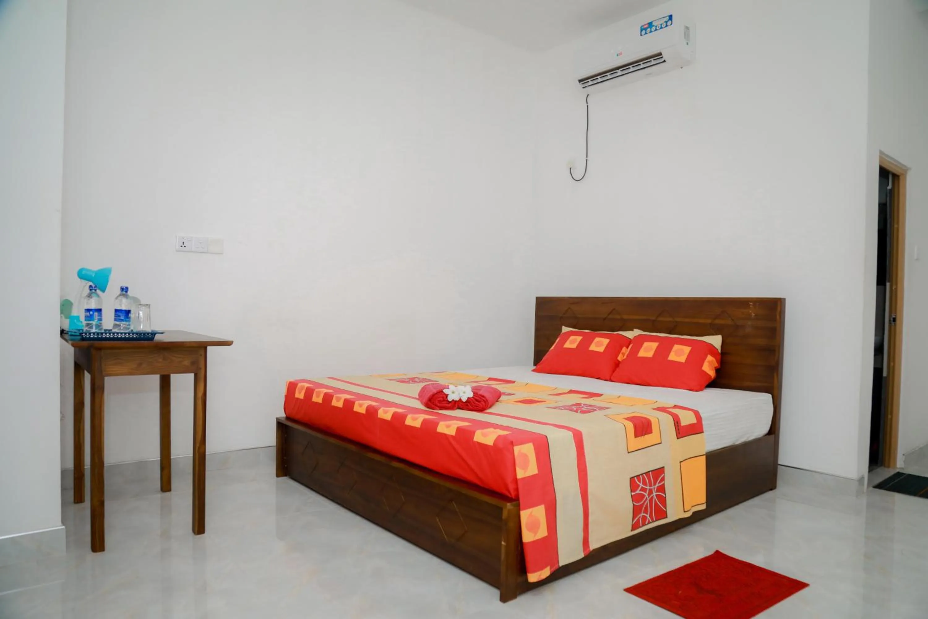 Bed in Araliya Lagoon Park Resort